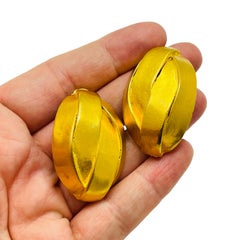 Vintage matte gold tone modernist designer 80's clip on earrings