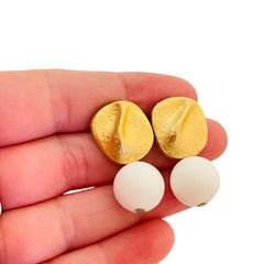 Vintage matte gold tone white lucite dangle ball designer earrings