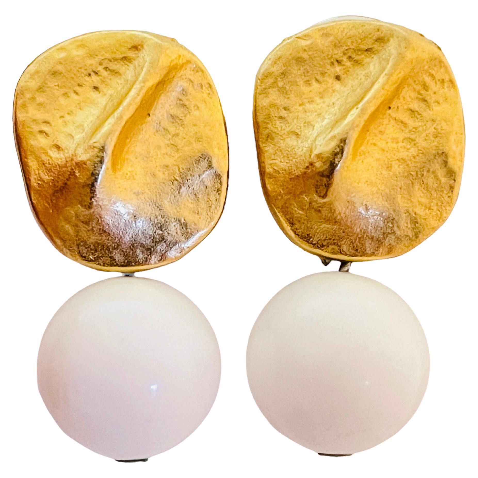 Vintage matte gold tone white lucite dangle ball designer earrings For Sale