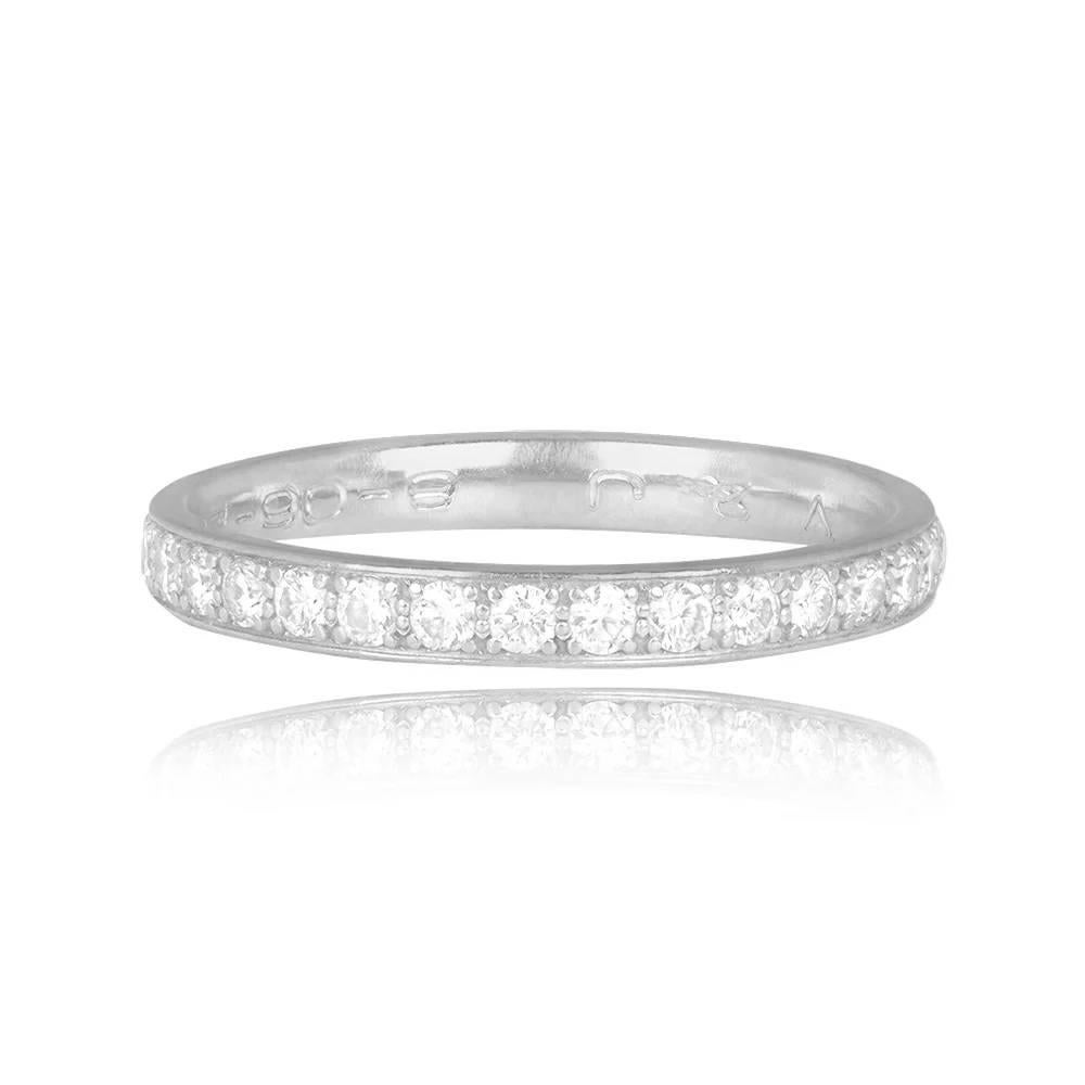 A vintage French Mauboussin wedding band featuring an eternity of round brilliant-cut diamonds channel-set in 18k white gold, with a total diamond weight of approximately 0.25 carats. Signed MAUBOUSSIN and bearing a French export stamp, the band has