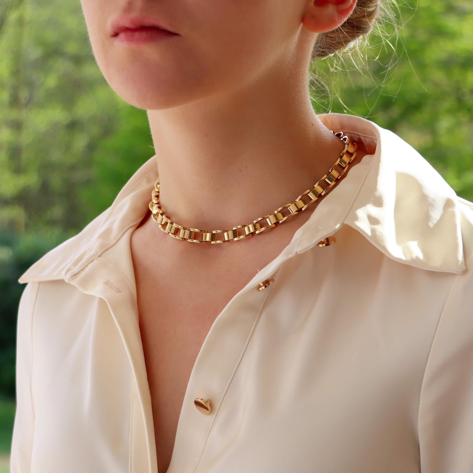  A beautiful vintage Mauboussin link necklace set in 18k yellow gold.

The necklace is composed of exactly 52 gold chunky links, connected in an articulated design so that it can sit on the wearers neck comfortably. Once on we see these lovely