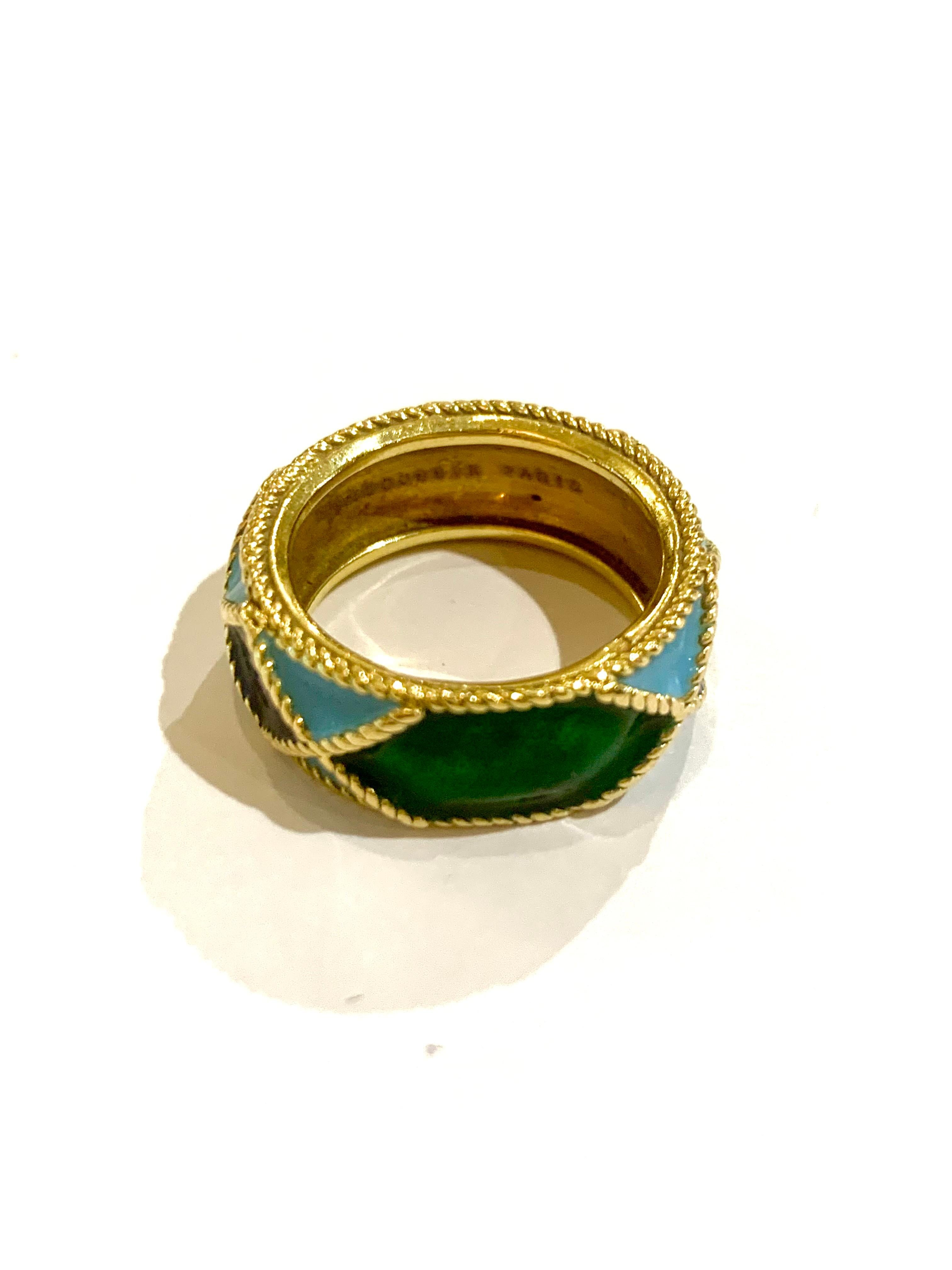 Vintage yellow gold ring signed Mauboussin Paris and numbered, the full band enamelled in shades of blue and green in a fine rope motif.

Signed Mauboussin Paris and numbered.

Dimensions: 8.13 x 2.38 mm (0.320 x 0.094 inch)

Finger size : 51.5 (US