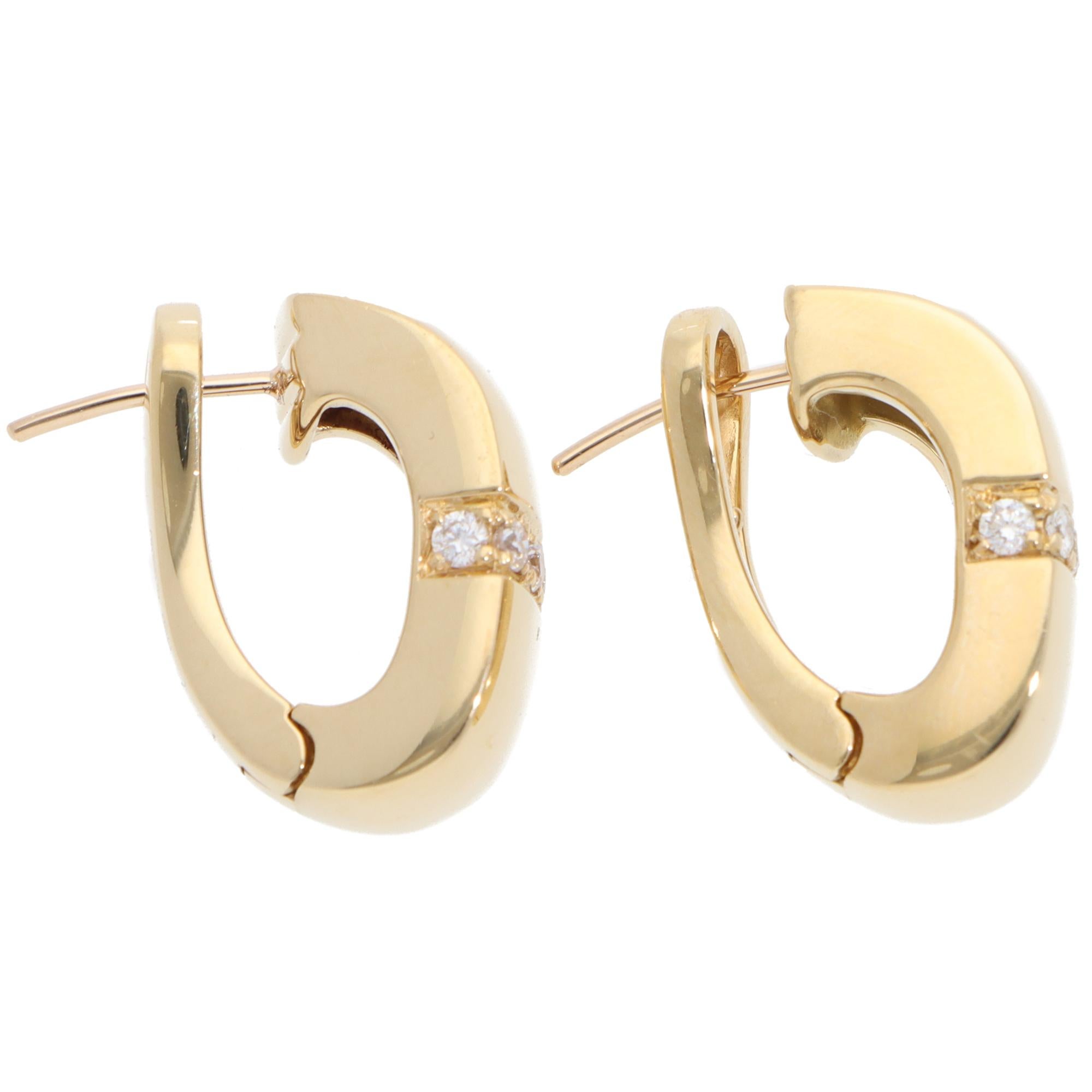 An interesting pair of vintage Mauboussin Paris diamond chunky hoop earrings set in 18k yellow gold.

From a discontinued collection, each earring depicts a chunky huggie polished yellow gold hoop which is solely set with a fine line of 10 round