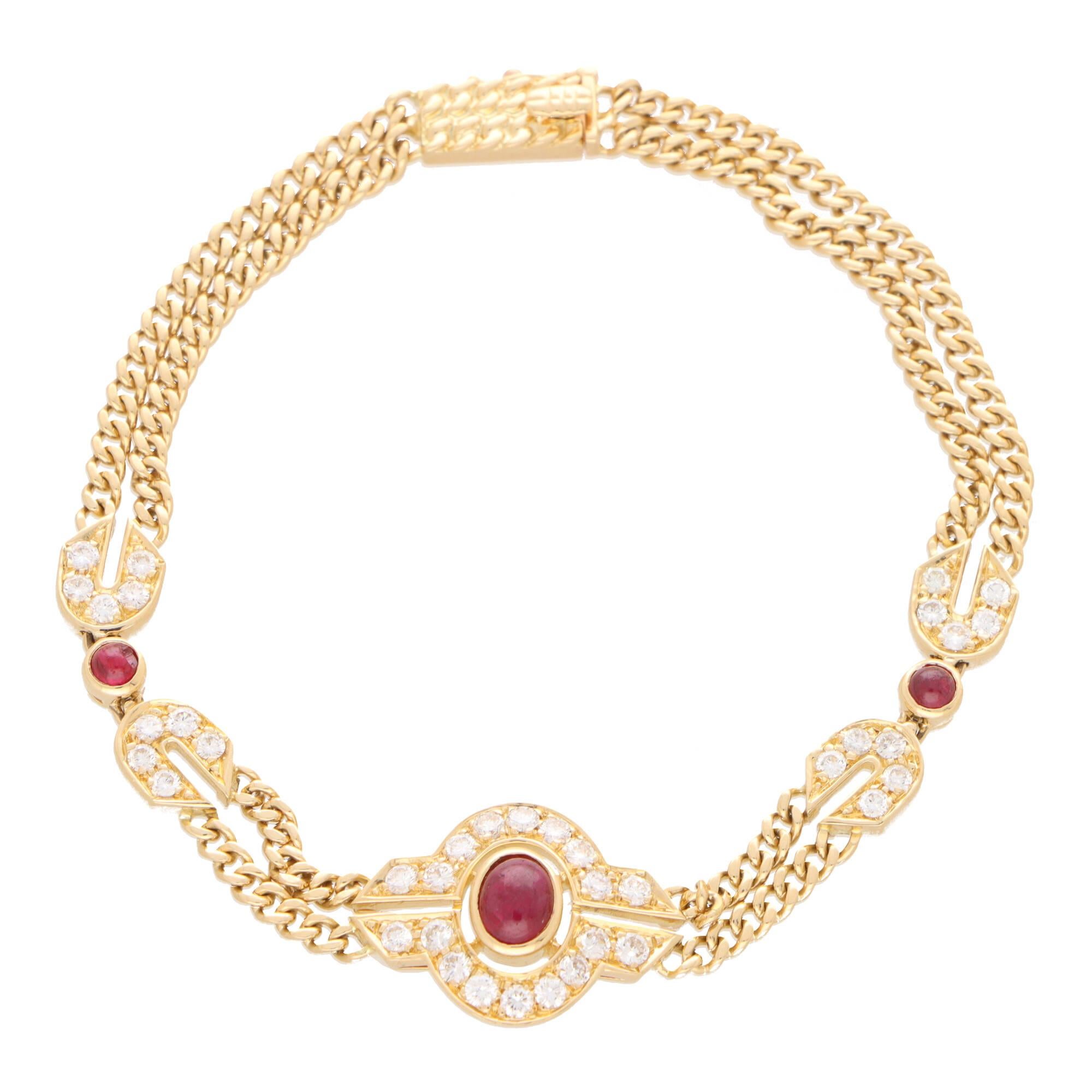 A beautiful vintage Mauboussin ruby and diamond Etruscan inspired chain bracelet set in 18k yellow gold.

The bracelet is centrally set with an openwork Etruscan inspired motif, set to the centre with a large oval cabochon ruby, and surrounded by