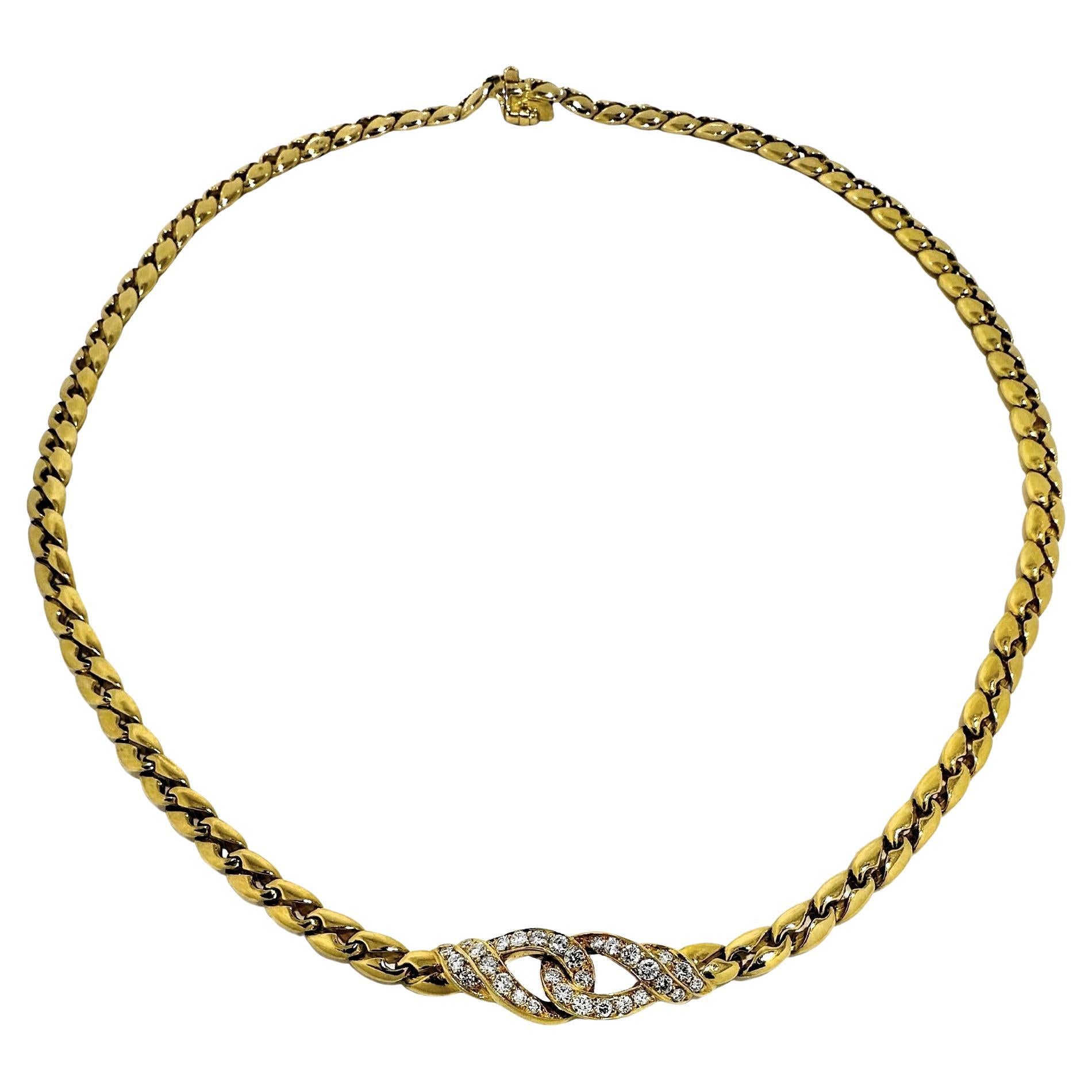 This lovely and elegant French Mauboussin choker necklace has, as it's central focus, a delicate love knot which is set with thirty brilliant cut diamonds having a total approximate weight of .85ct. Diamonds have an overall quality of G color and