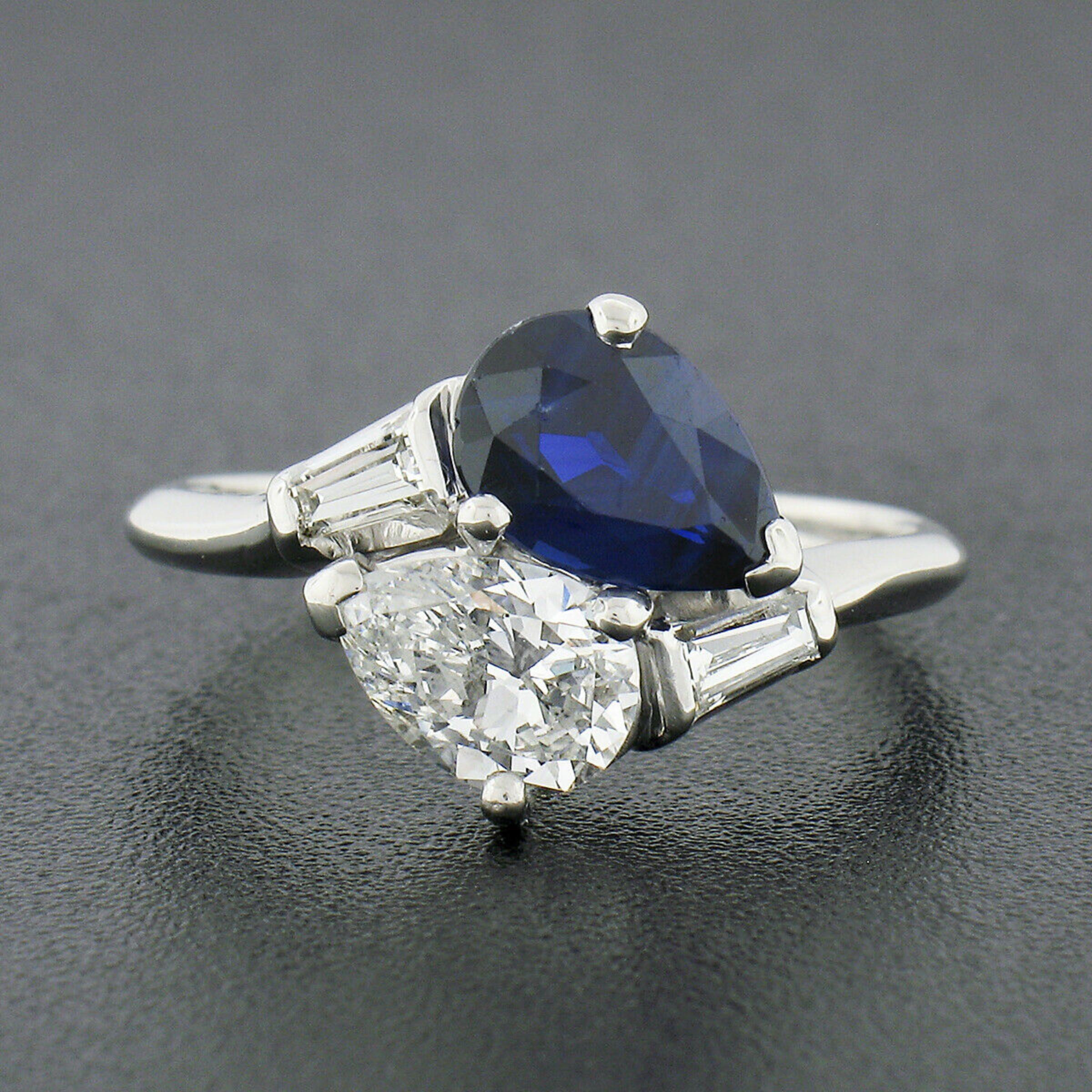 This vintage, Maurice Tishman, bypass ring is very well crafted in solid platinum and features a GIA certified pear cut sapphire neatly prong set at one end of the bypass design. The fine sapphire stands out with its rich royal blue color, while the