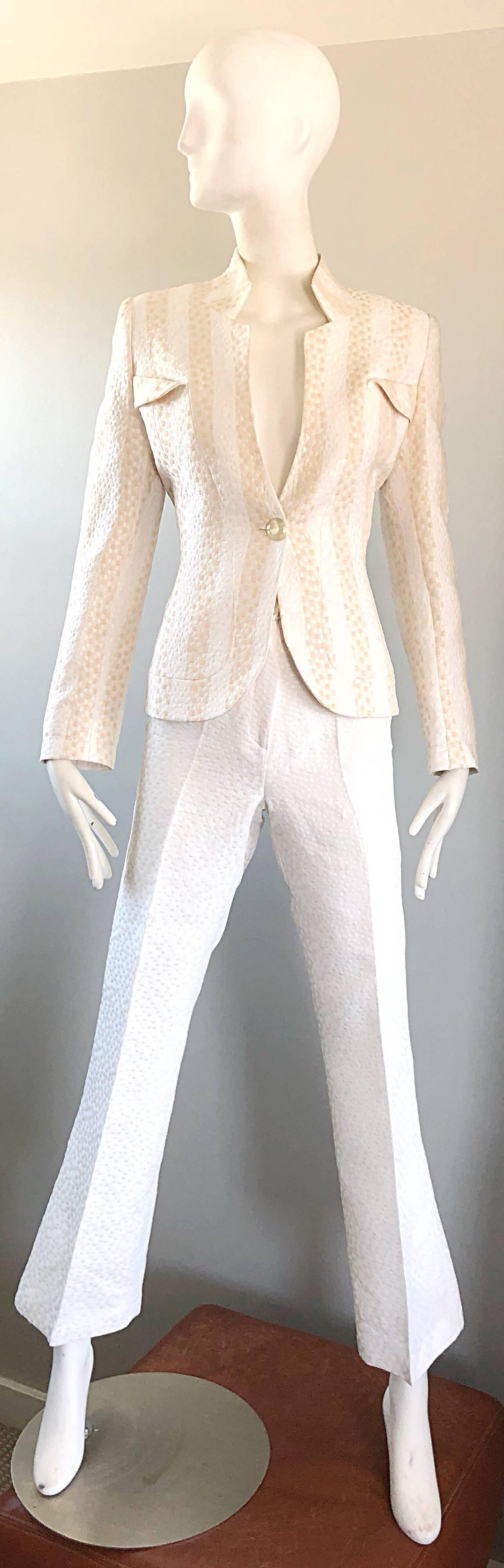 Wonderful vintage 90s MAX NUGUS COUTURE white and beige slim tailored silk trouser suit! Avant Garde blazer jacket is expertly tailored with a slim fit. Beige and white polka dots printed throughout. Single button closure. High waisted white polka