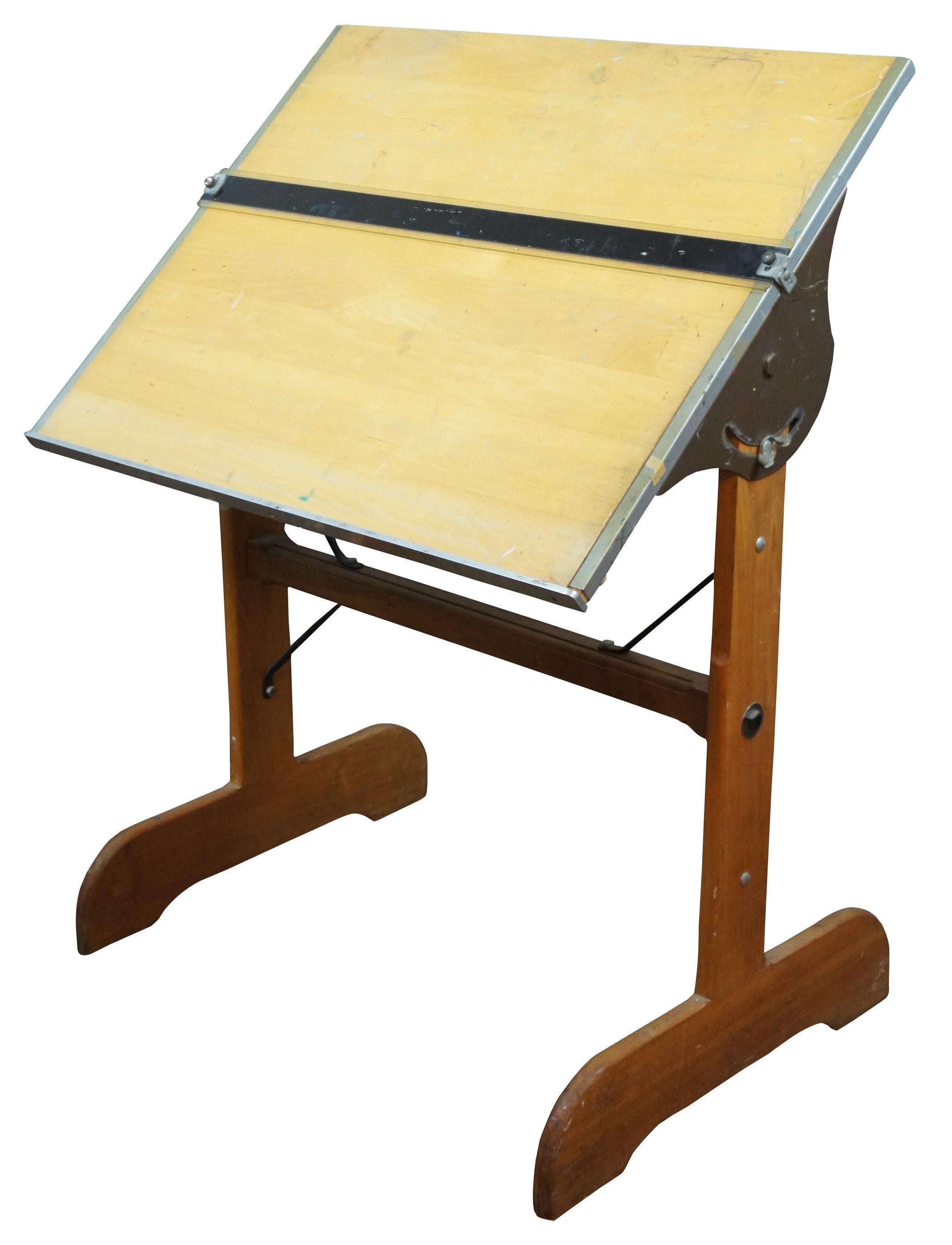 Vintage Mayfield Company Inc. industrial drafting table or architectural desk with wooden trestle legs, surface adjustable from 90 degrees vertical to 90 degrees horizontal, and horizontal straight edge slide. Sheboygan Wisconsin, Equipment for the
