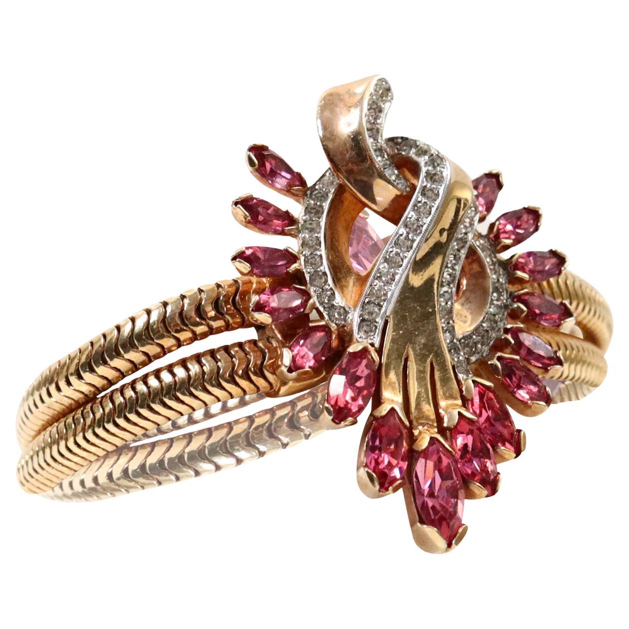 Vintage Mazer Gold and Diamante With Pink Bracelet, circa 1960s.  This is one of the prettiest and most well made bracelets in the collection. This looks like fine jewelry at its best. There are two pieces of snake like that have a large medallion