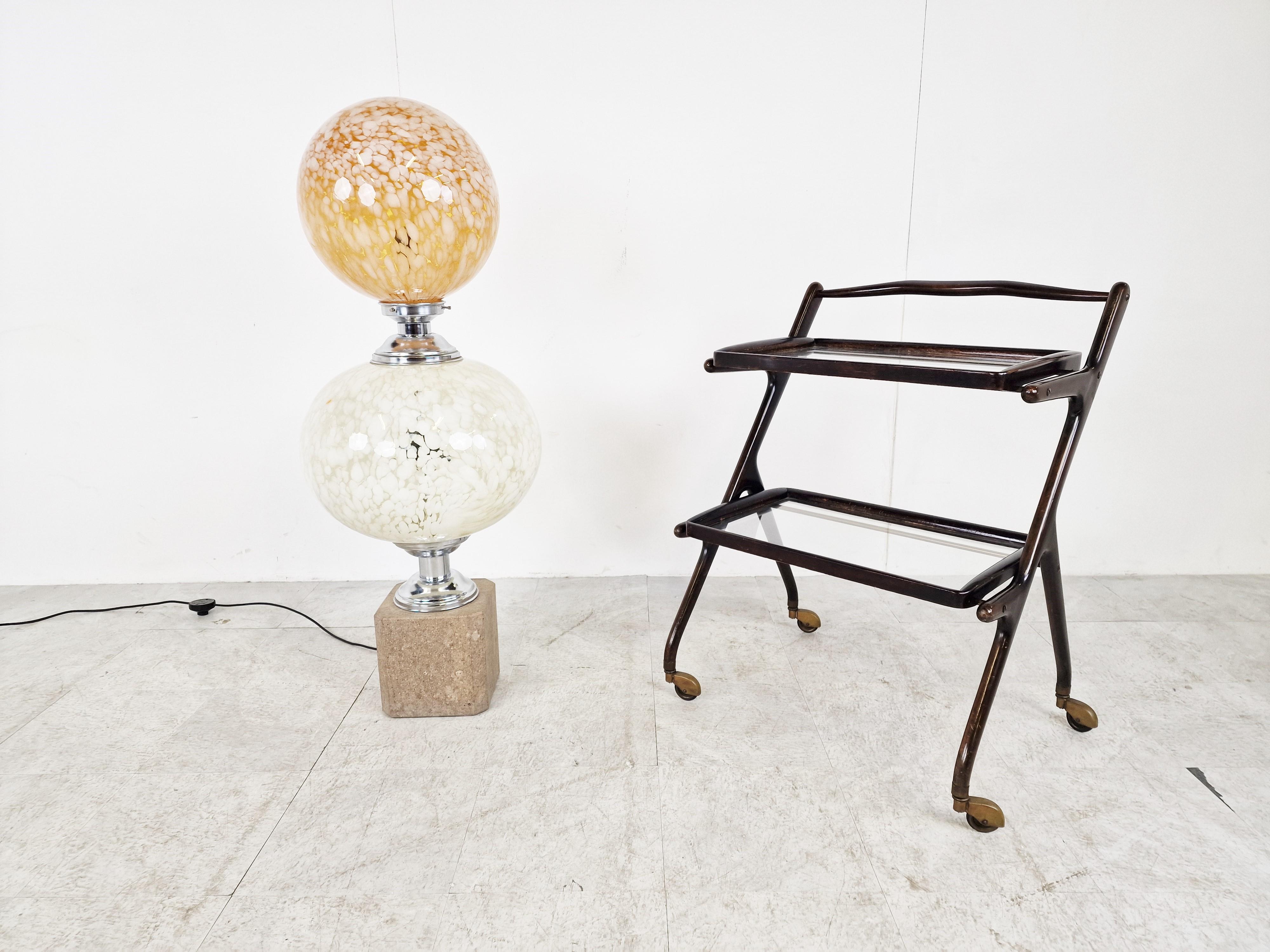 Rare floor lamp with two murano glass globes and a marble and chrome base.

The lamp emist a beautiful soft and dim light.

Tested and ready for use.

Very good condition

The lamp works with two regular E26/E27 light bulbs. 

1960s -