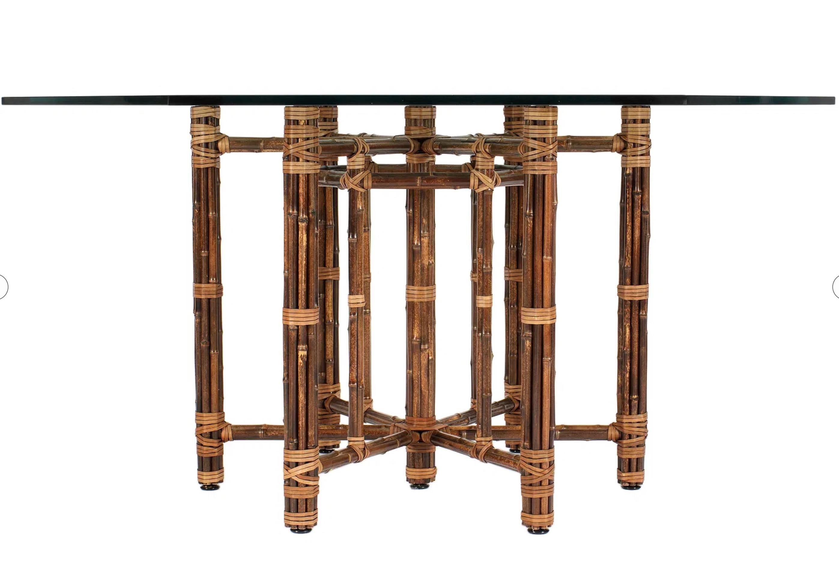 A stunning example of early McGuire design, this organic modern dining table features model #MCBA17, crafted with a sculptural hexagonal iron frame meticulously hand-wrapped in blonde-toned bamboo poles. The joints are expertly lashed in light cream