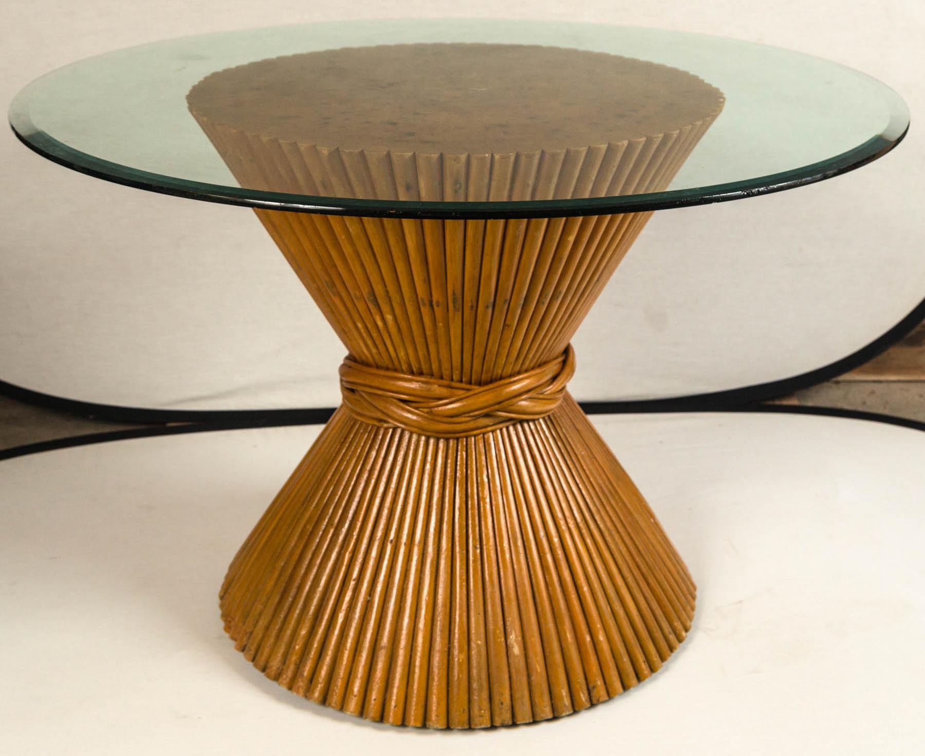Vintage McGuire bamboo pedestal table. Sheaf of wheat design base with glass top. Original finish with aged patina. An iconic design by Eleanor and John McGuire.