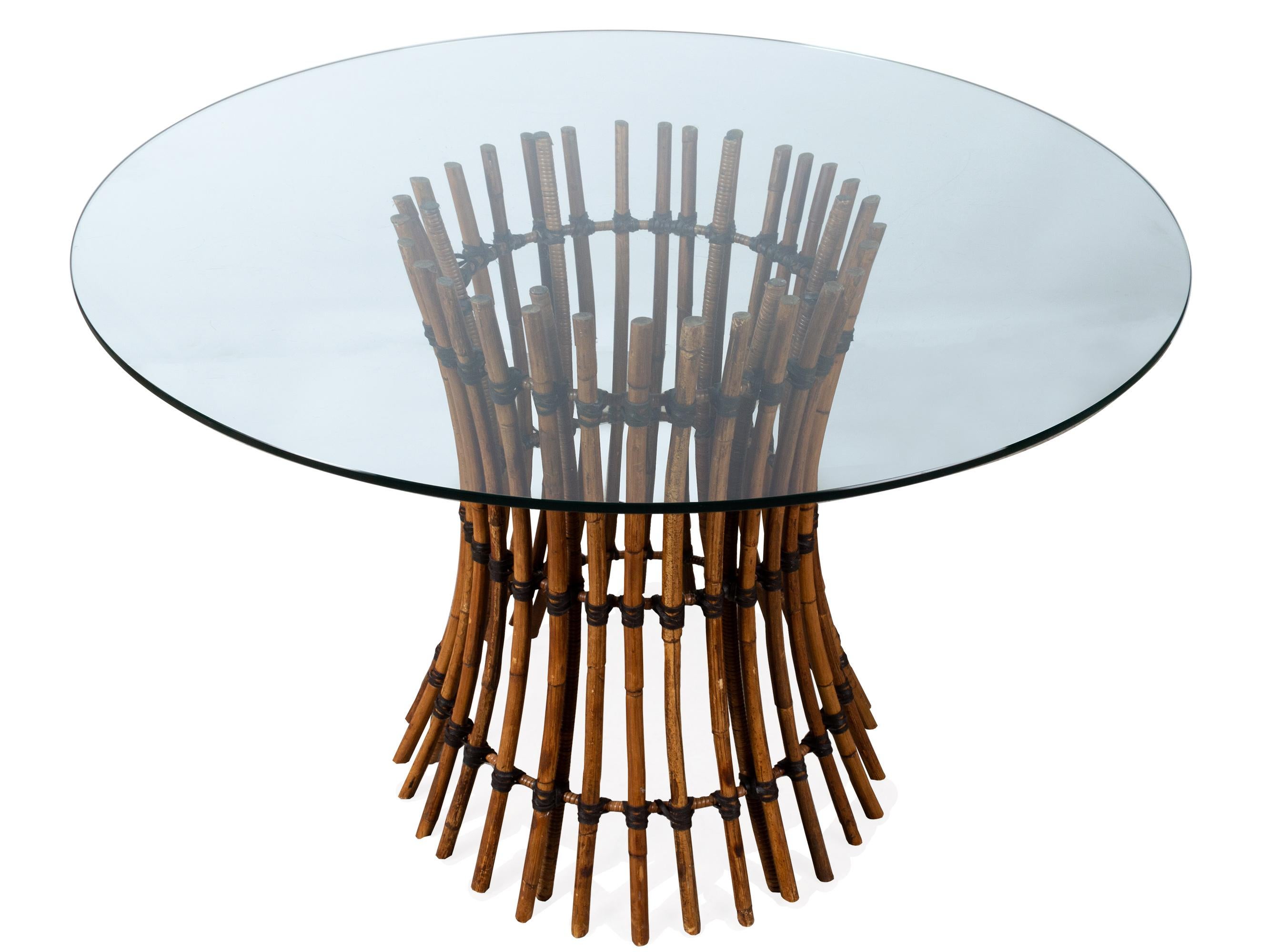 Vintage McGuire California Circular Glass & Bamboo Dining Table, USA, circa 1970

Circular glass top dining table constructed in iconic McGuire California leather wrapped bamboo.
Excellent original vintage condition. Very minor wear from age.