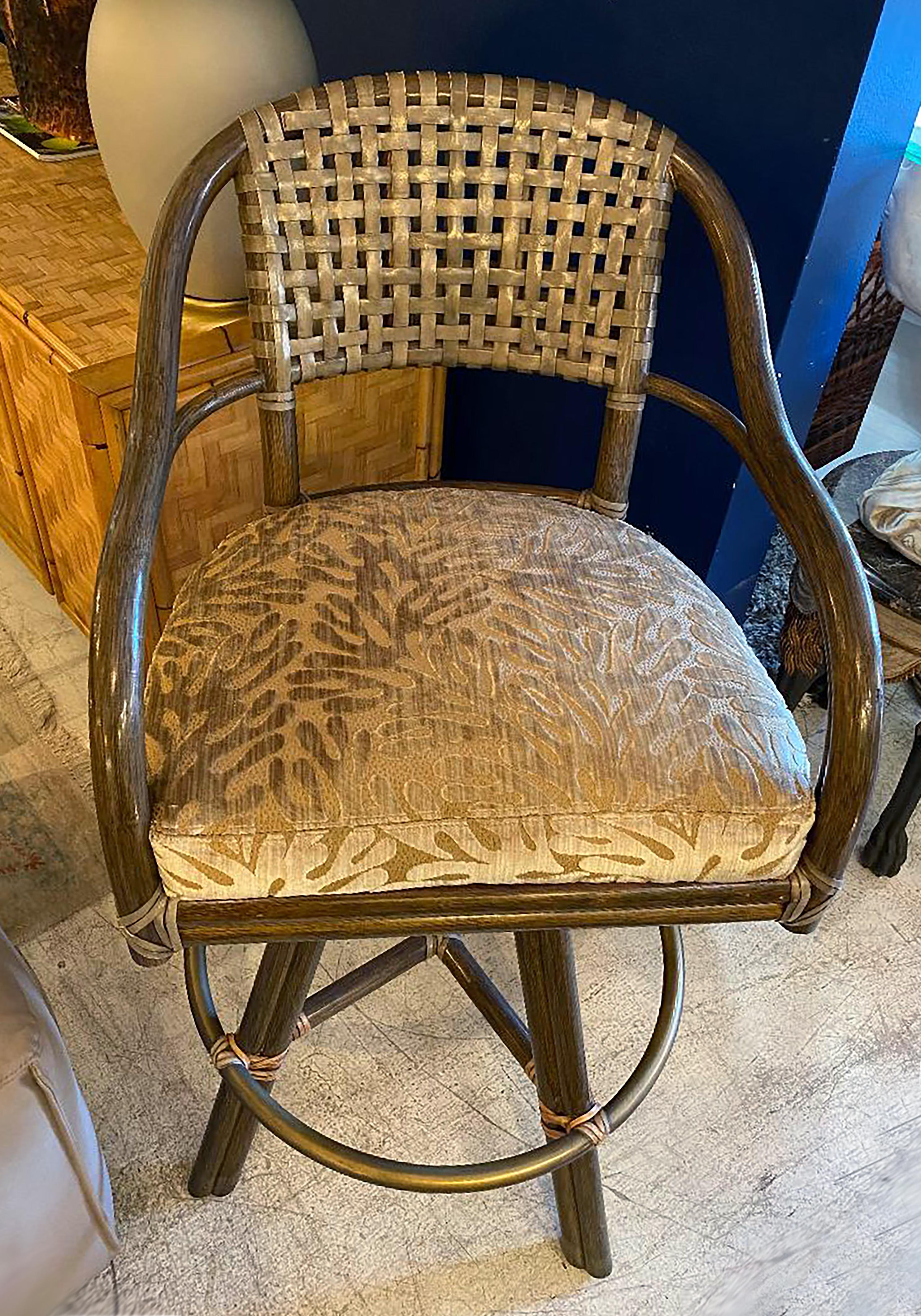 Vintage McGuire rattan and leather swivel bar stools, set of 3

Offered for sale is a set of three vintage McGuire bent rattan and woven leather swivel bar stools. The stools are from the McGuire San Francisco Collection and they have been newly