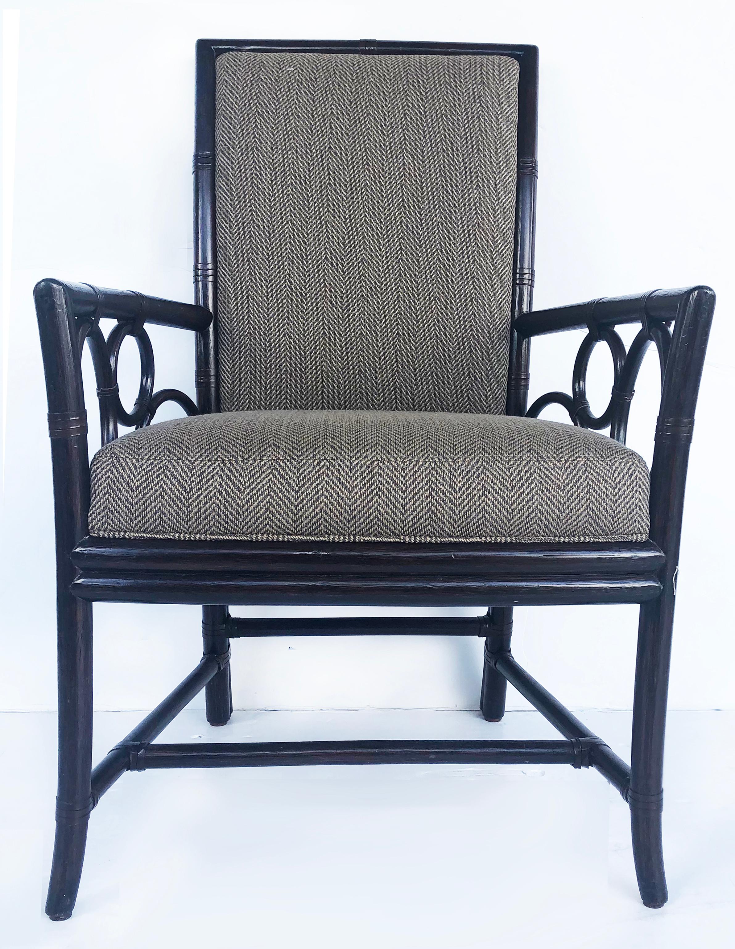 Vintage McGuire rattan armchairs, newly upholstered pair

Offered is a pair of newly upholstered rattan and leather banded armchairs by McGuire of San Francisco. The chairs have been finished in dark chocolate and reupholstered in Holly Hunt fabric.