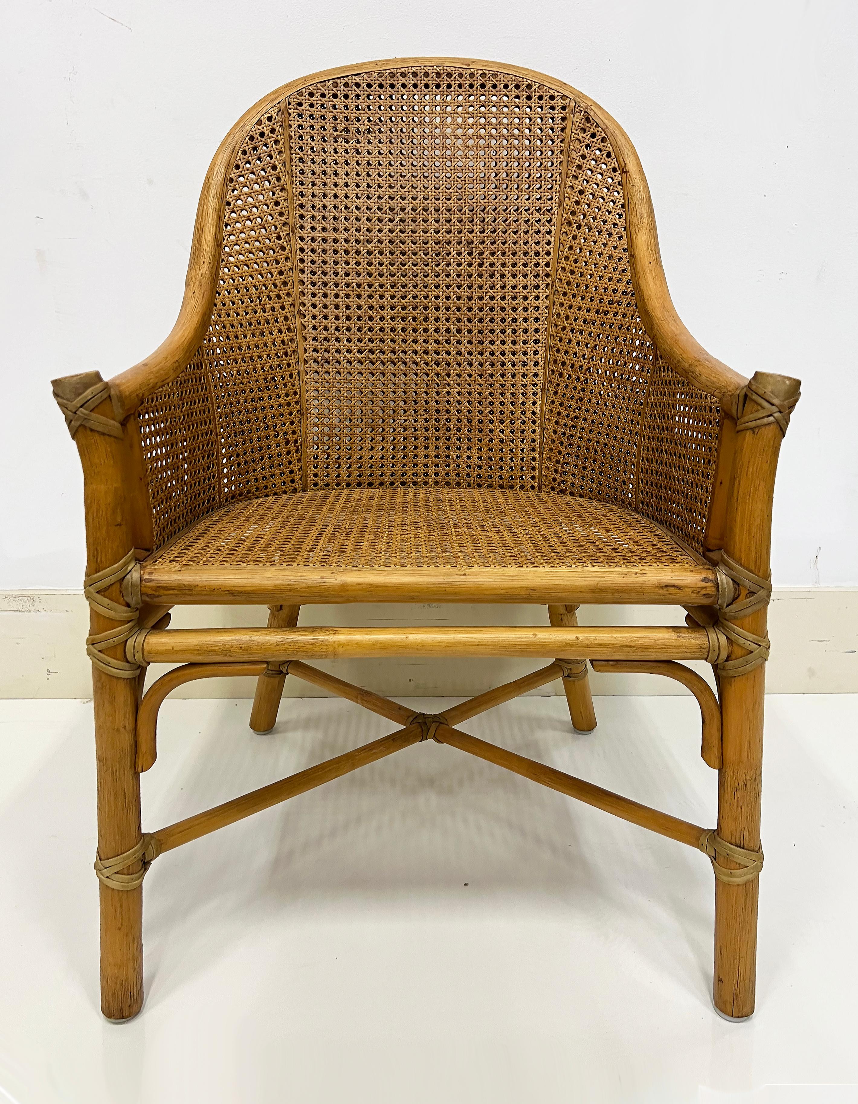 Vintage McGuire San Francisco Rattan, Woven Cane, Rawhide Armchairs, Pair

Offered for sale is a pair of vintage McGuire San Francisco armchairs created in rattan with woven cane panels surrounding the frames.  These quality chairs have panels that