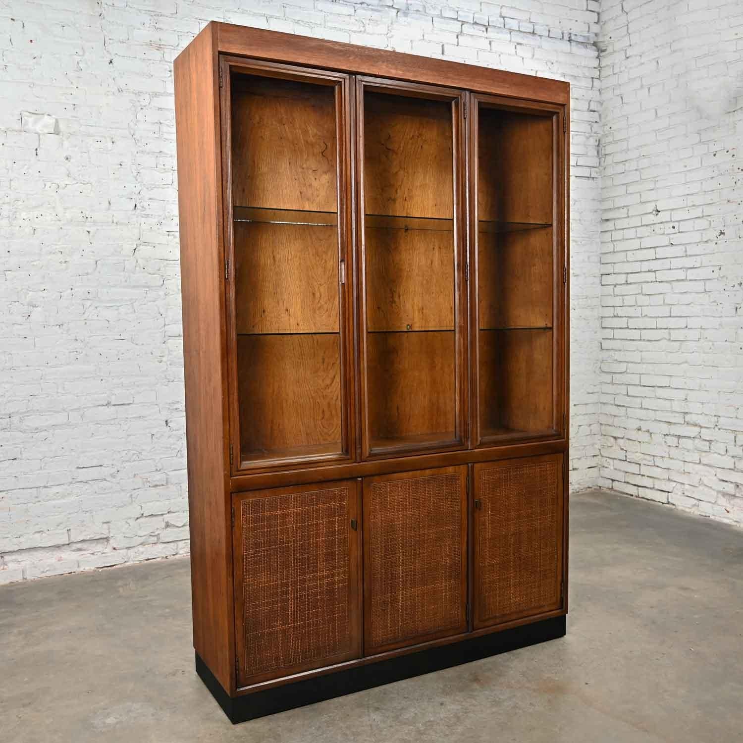 20th Century Vintage MCM 1 Piece Walnut & Radio Weave Cane Front Lighted China Cabinet For Sale