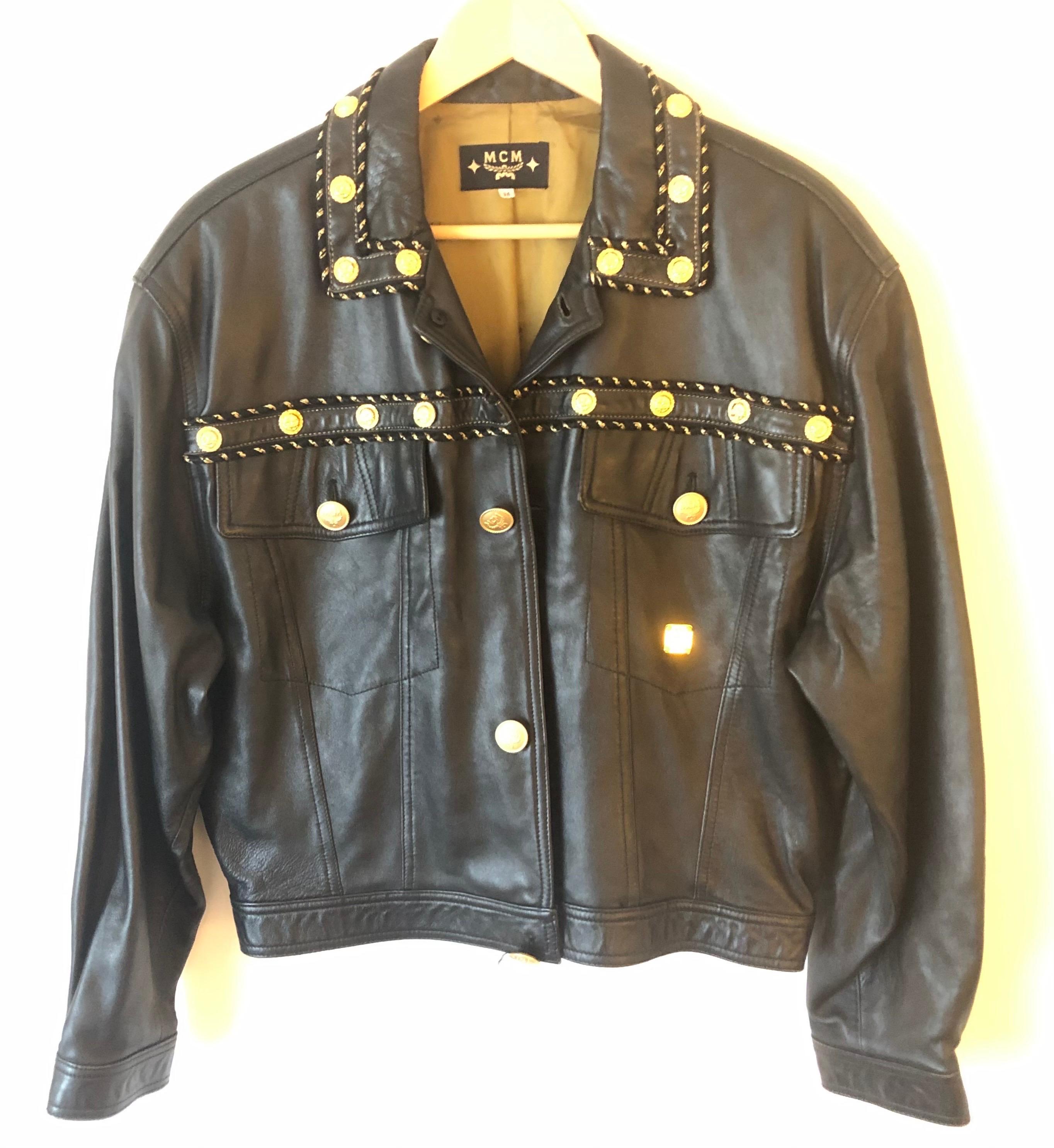 Gorgeous vintage MCM black leather jacket with gold plate and buttons.