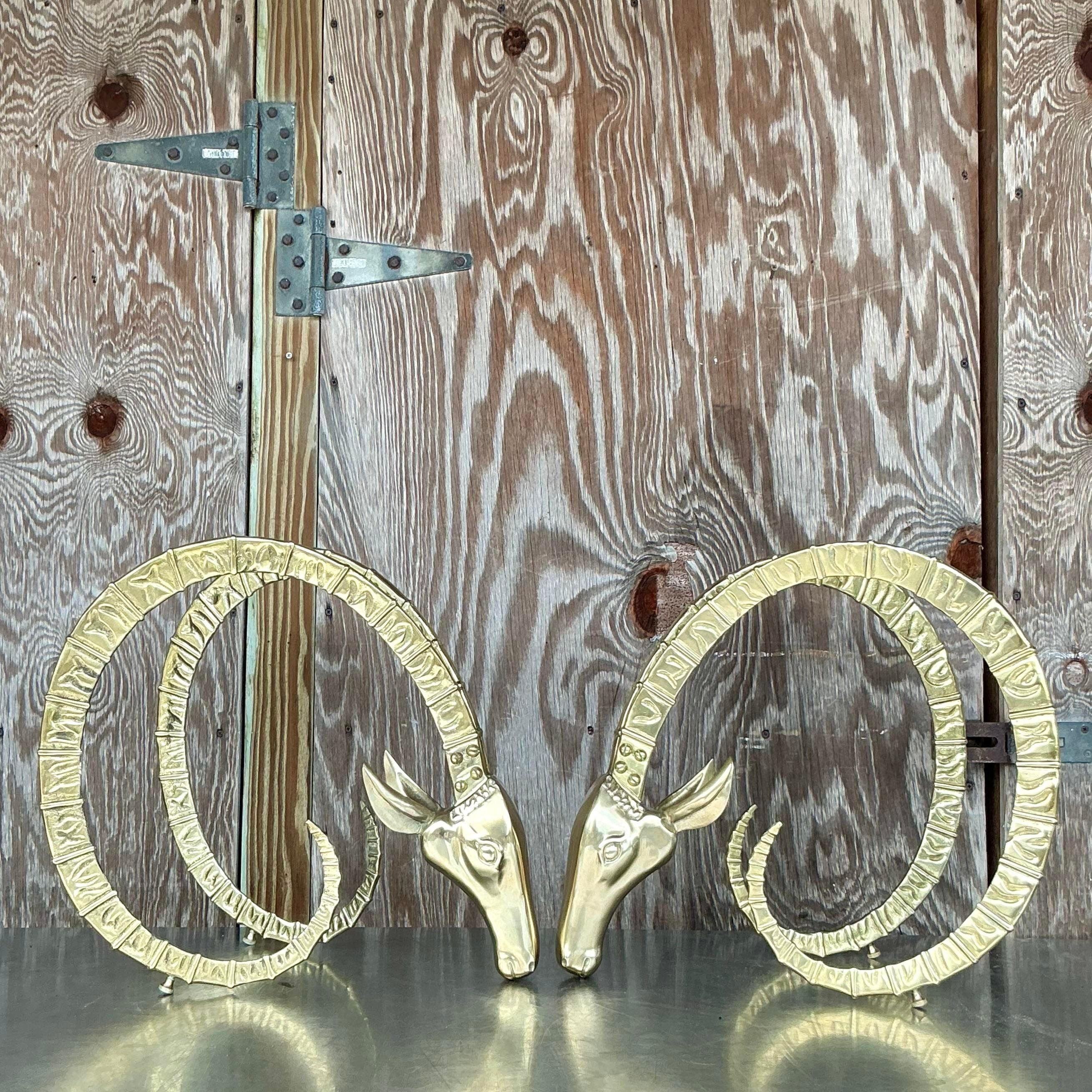 Elevate your living space with these Vintage MCM Brass Ram’s Head Coffee Table Pedestals, a striking set of two. Perfect for American-style interiors, these pedestals feature intricately detailed ram's head designs, embodying the bold elegance of