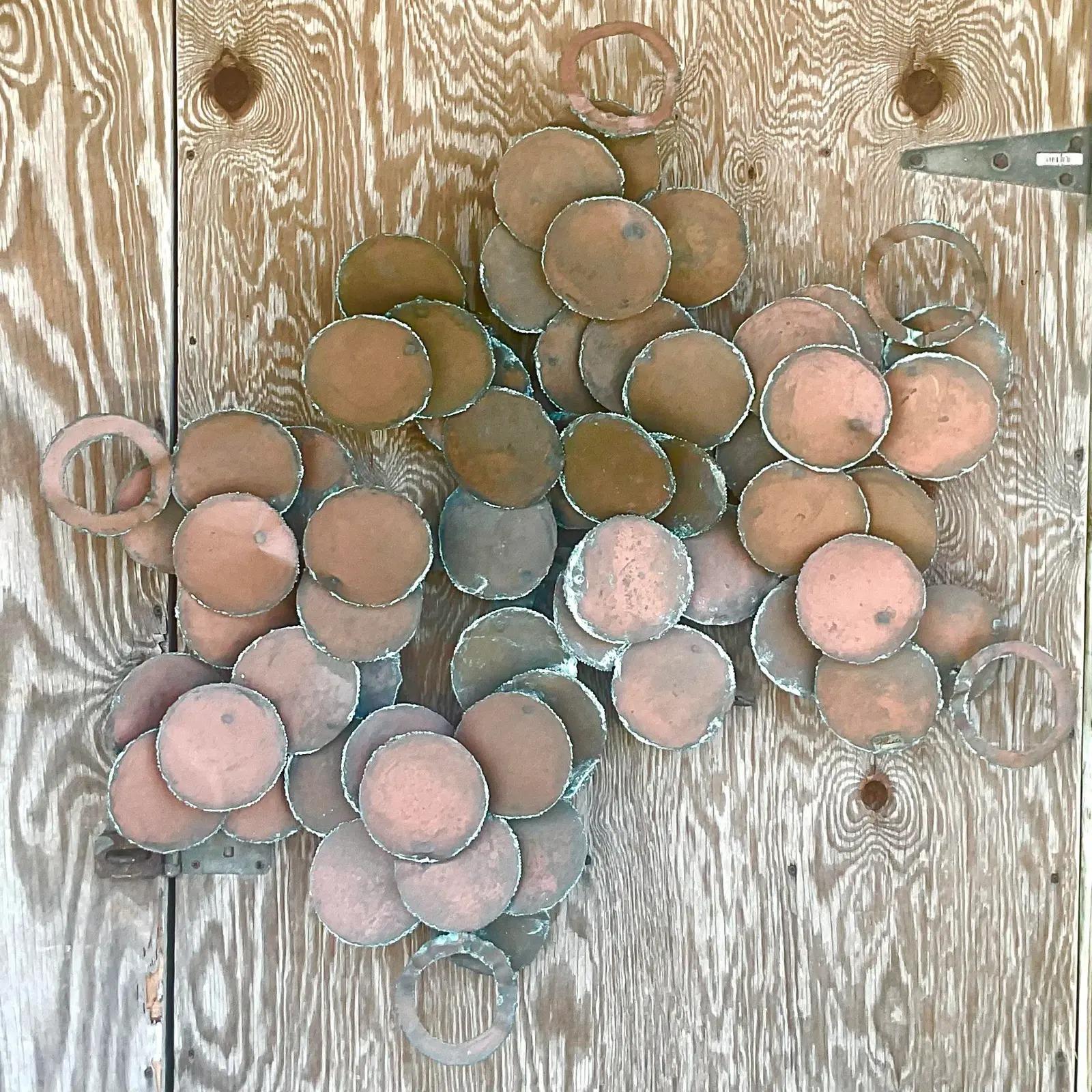 Fabulous vintage MCM wall sculpture. Torch cut copper discs arranged in the Brutalist style. Lots of movement and energy. Signed by the artist William Friedle. Acquired from a Palm Beach estate.