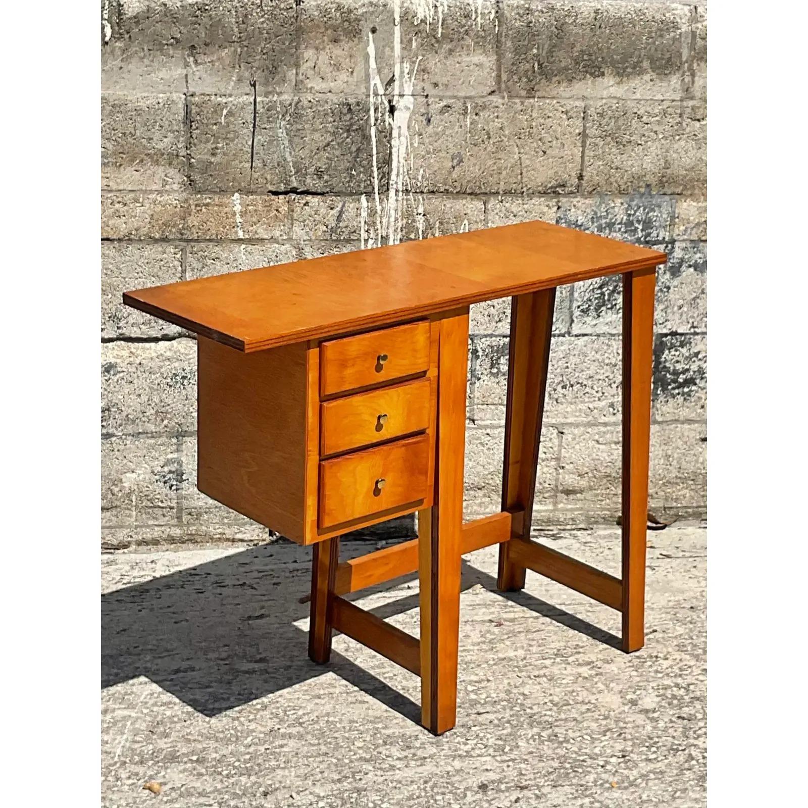 Incredible vintage MCM writing desk. A chic little writing spot that was hand made. Constructed in plywood in a really iconic MCM look. Acquired from a Palm Beach estate.