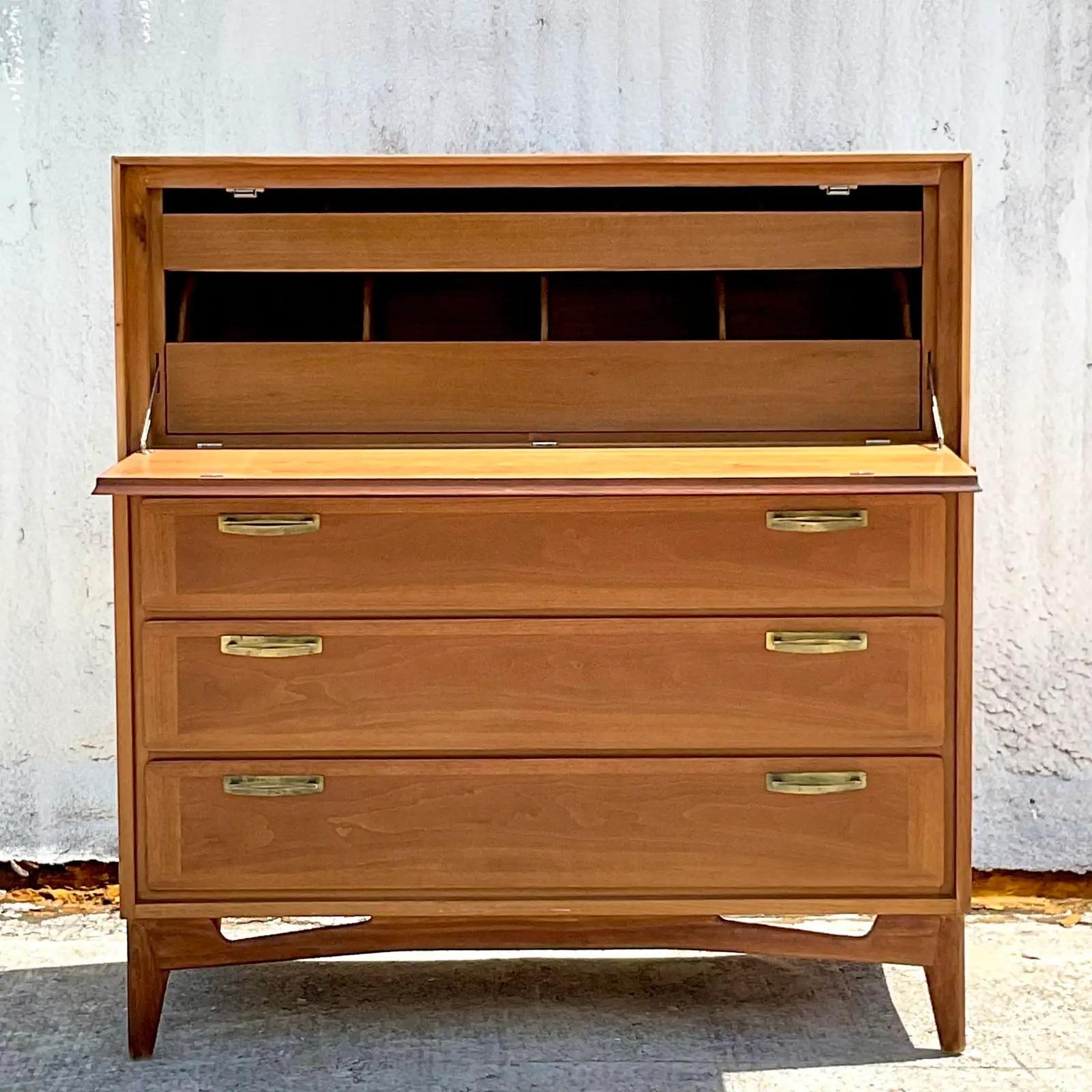 Handsome vintage MCM gentleman’s chest. Beautiful diamond wood pattern. Drop down front reveals a great set of drawers and cabinets. Acquired from a Palm Beach estate.