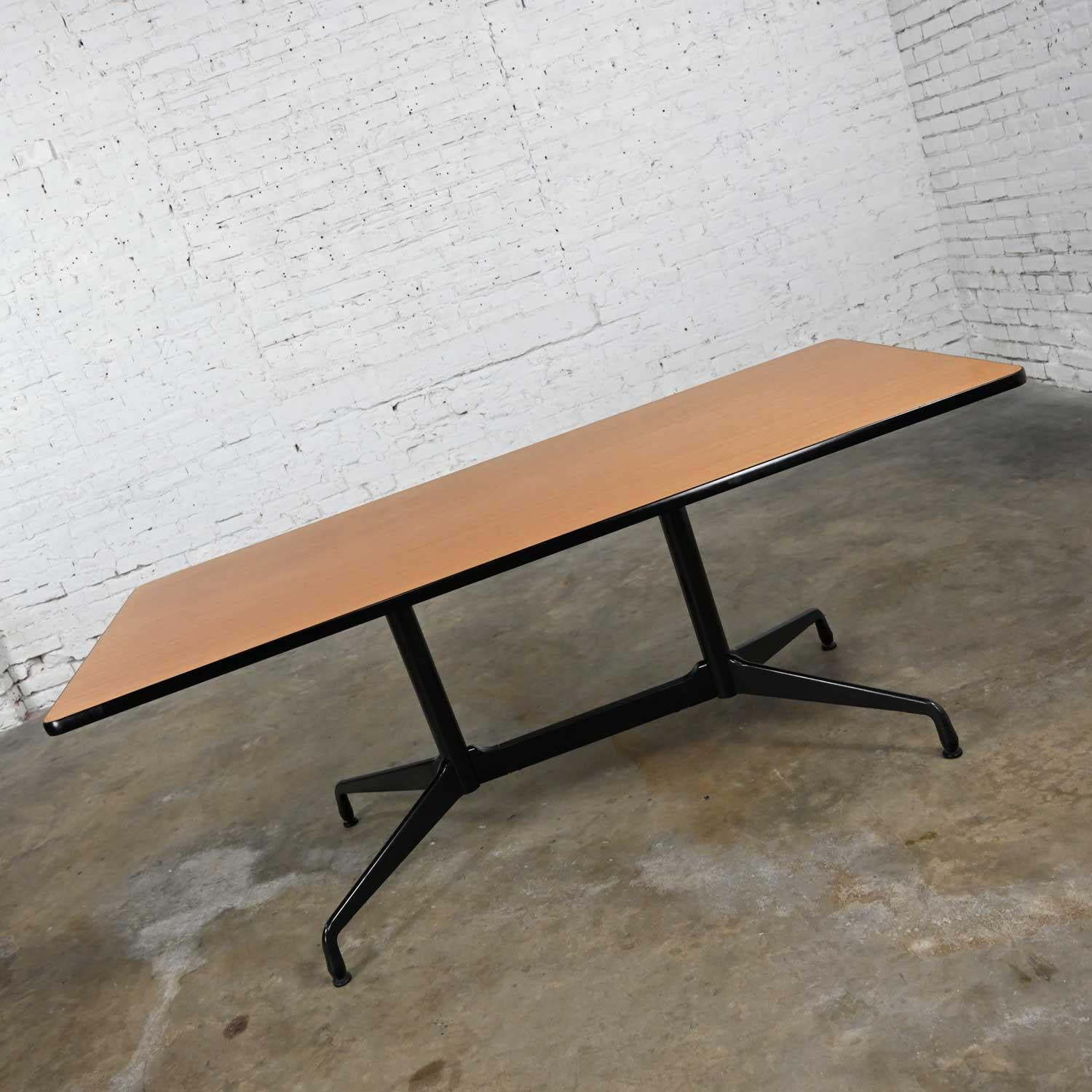 Classic Eames for Herman Miller segmented base table with black base and table edge, rectangular natural oak wood veneer top, and aluminum spider attachment. Beautiful condition, keeping in mind that this is not new so will have signs of use and