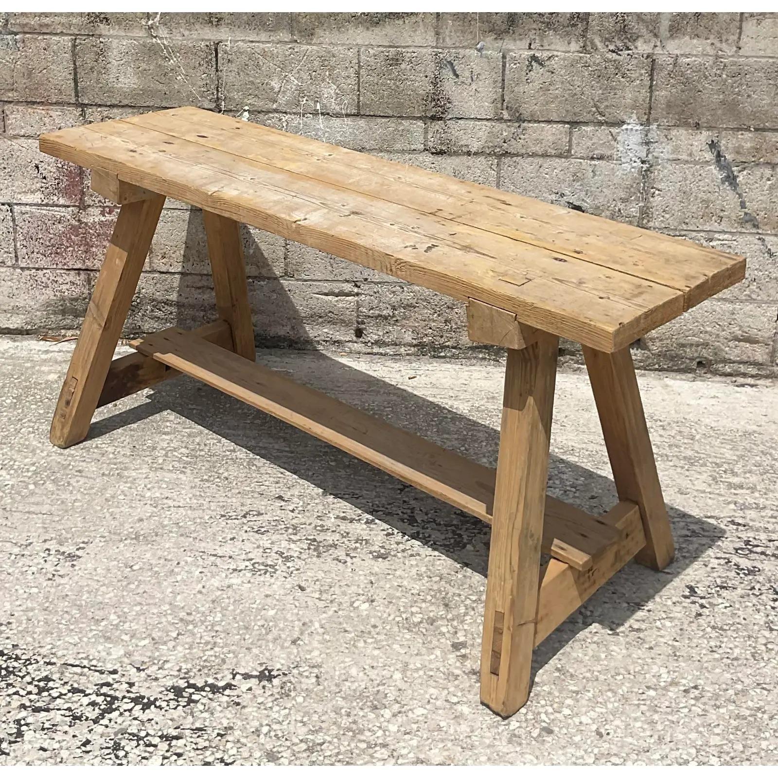 Fantastic vintage MCM splayed leg console table. Constructed using Antique French planks and joined using ancient Japanese techniques. Chic in its simplicity. Acquired from a Palm Beach estate.