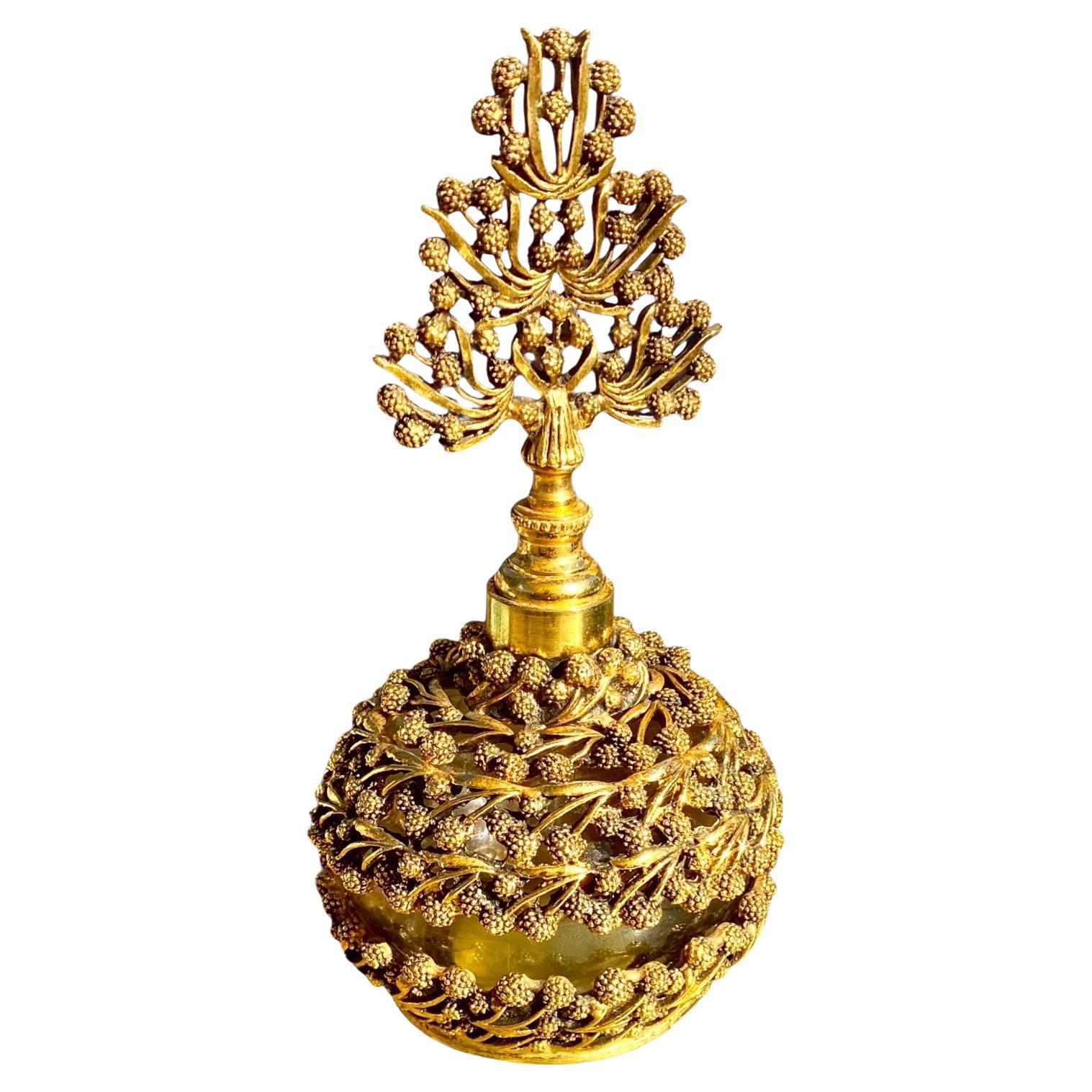 Bottiglia di profumo MCM tedesca placcata in oro con tappo a forma di gelso in vendita