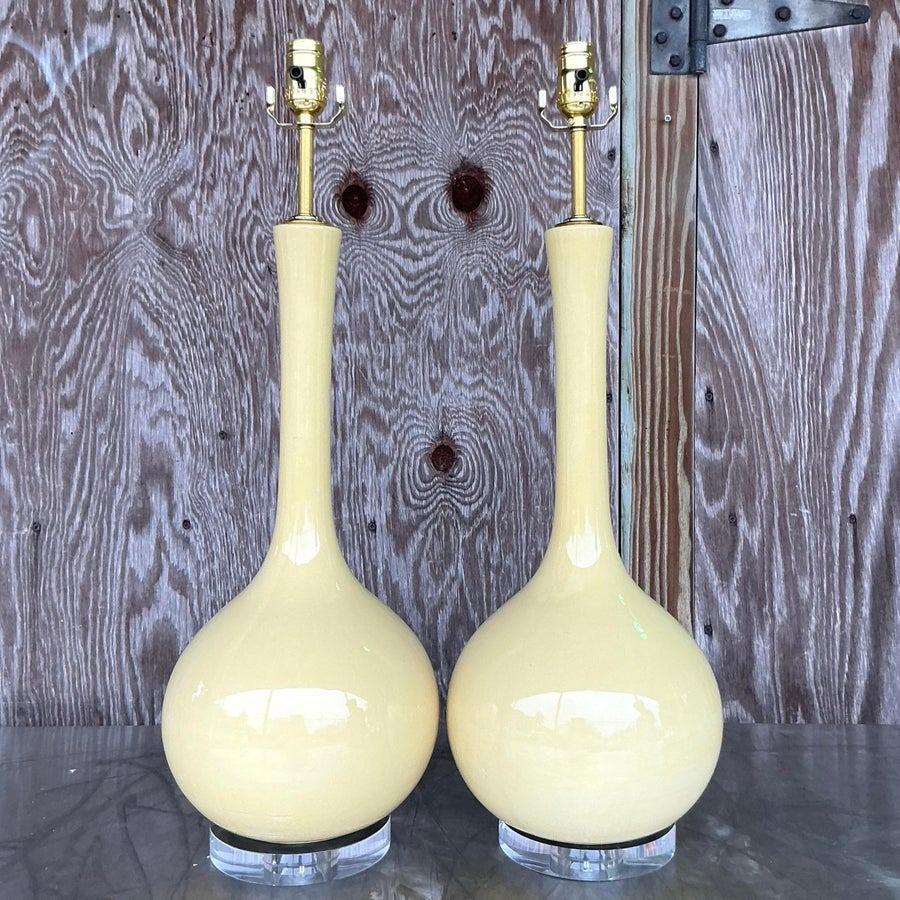 The Vintage Mid-Century Modern (MCM) Glazed Ceramic Gourd Lamps are a perfect blend of retro style and functional design. Featuring a distinctive gourd shape, these lamps are crafted with a glazed ceramic finish, showcasing vibrant hues and rich