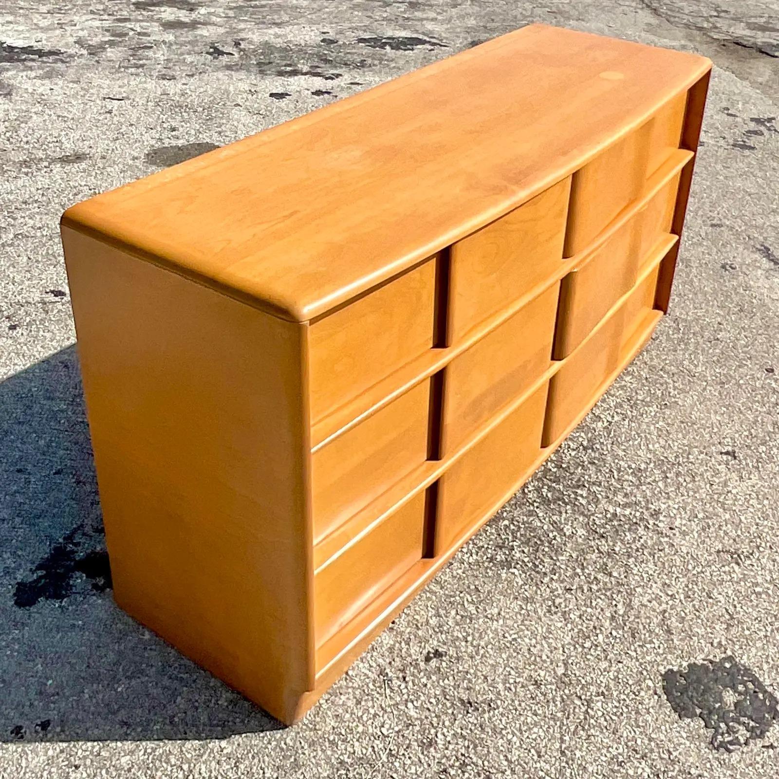 A fantastic vintage MCM six drawer dresser. Made by the iconic Heywood Wakefield and marked on the inside. A chic wave front design in a beautiful warm finish. Just the coolest dresser out there. Acquired from a Palm Beach estate.