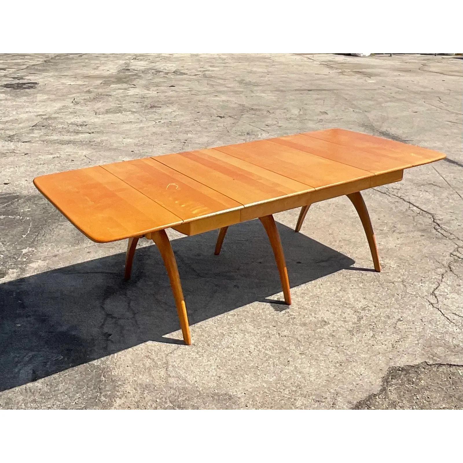 Fantastic vintage MCM dining table. Made by the iconic Heywood Wakefield. The coveted Wishbone shape with long slender legs. Acquired from a Palm Beach estate.