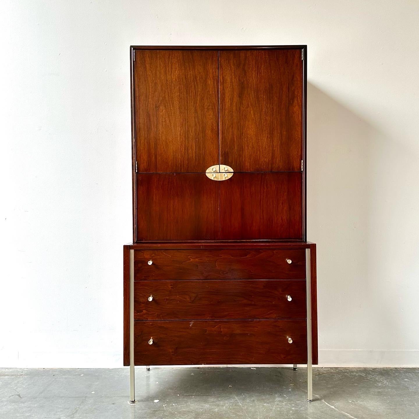 Rare highboy cabinet by Mengel furniture 

Designed by Raymond Loewy circa 1950

Gorgeous piece with loads of storage.
Three large drawers, drop down cabinet , and storage space up top.

Great condition with minor signs of wear.

Dimensions:
36L x