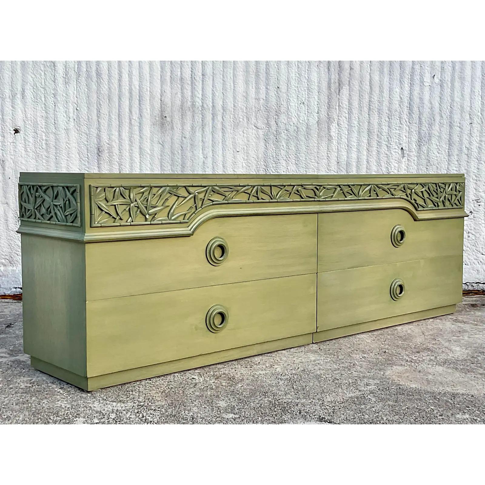 A spectacular vintage MCM double dresser. Made by the iconic James Mont. A band of carved bamboo across the top. A chic cerused green finish. Acquired from a Palm Beach estate.

Individual dresser length 48.5'