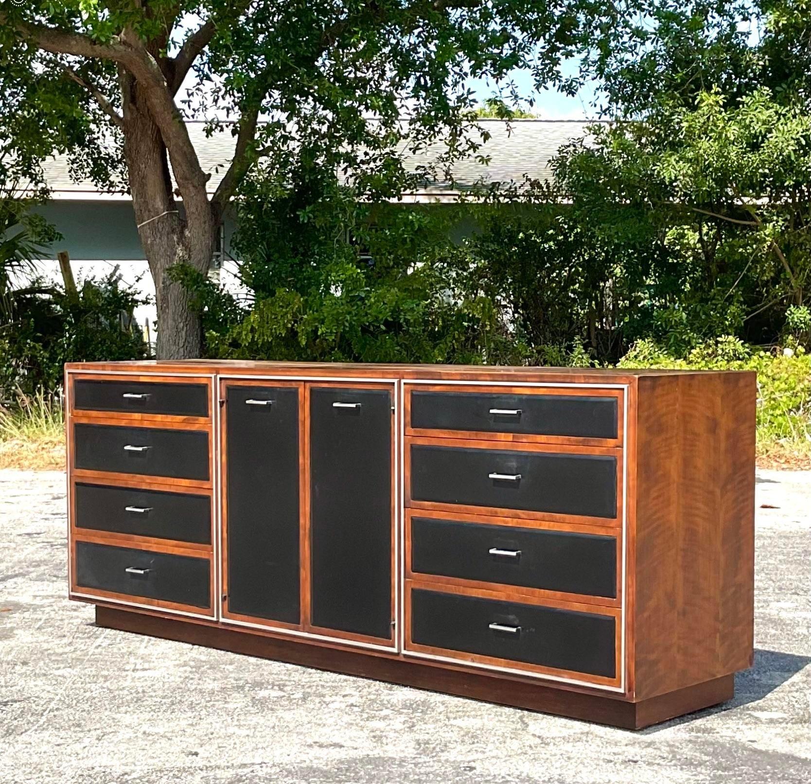 A fantastic vintage MCM leather front dresser. Made by the iconic John Stuart. Tagged inside the drawer. A chic and rare find. Acquired from a Palm Beach estate.