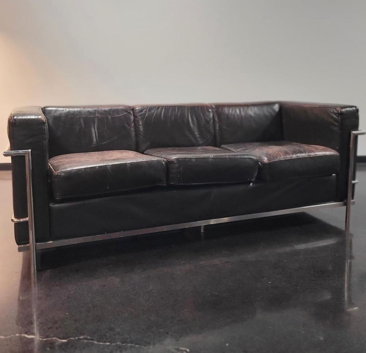 Beautiful vintage MCM Le Corbusier LC2 style sofa with chrome frame and a very deep chocolate brown leather that seats 3.