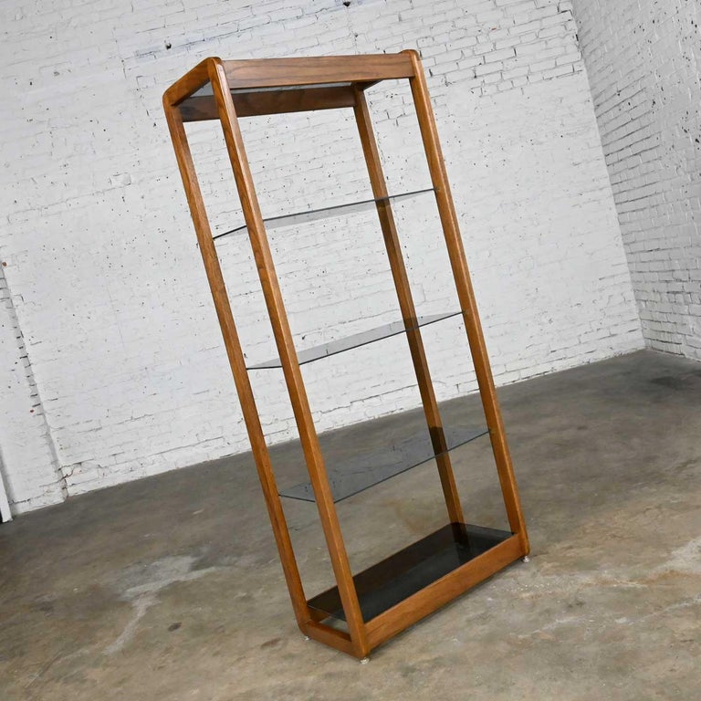 Wonderful vintage Mid-Century Modern oak frame and smoked glass shelves etagere, display shelf, or bookcase with adjustable chrome & nylon feet. Beautiful condition, keeping in mind that this is vintage and not new so will have signs of use and