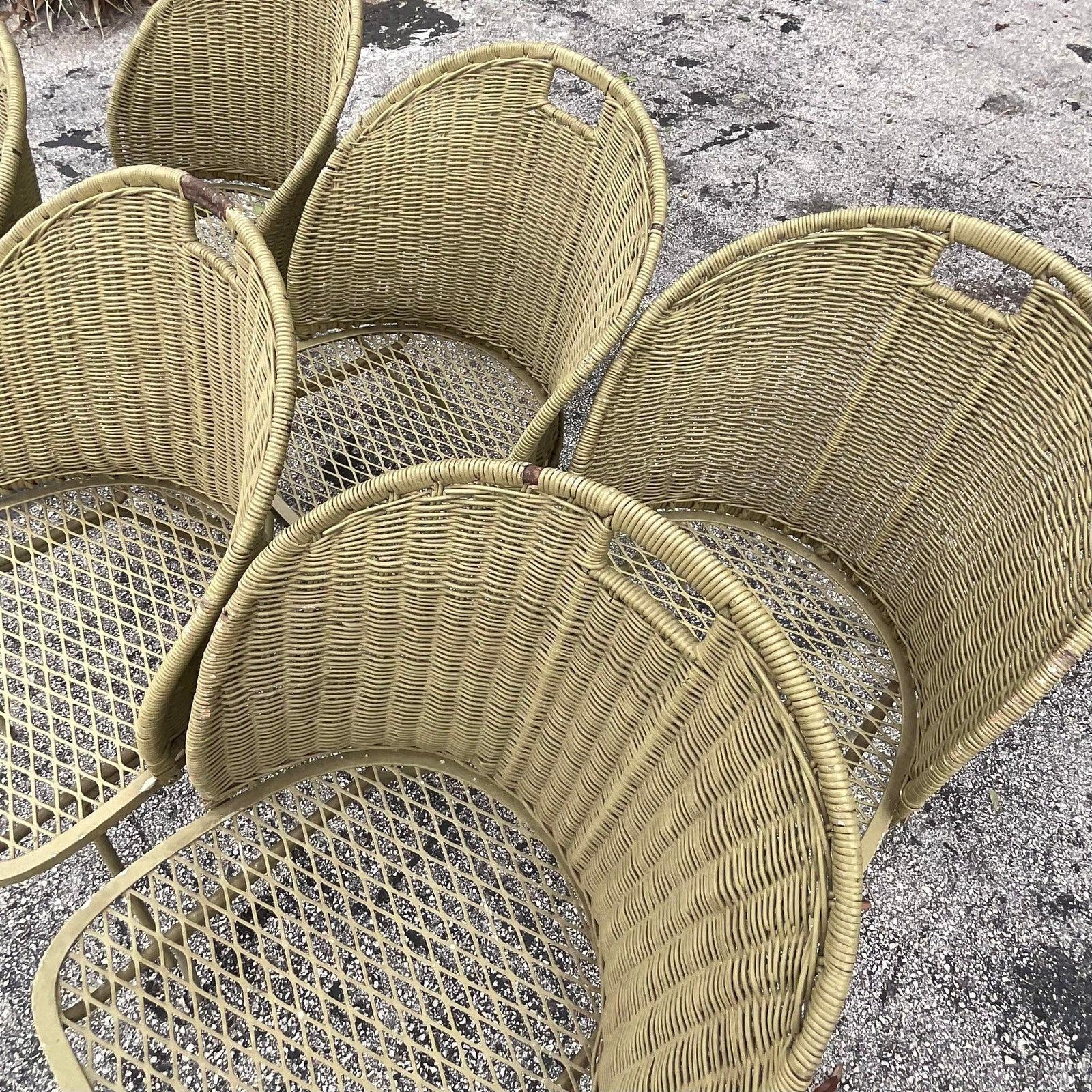A fabulous set of 6 vintage MCM outdoor dining chairs. Designed by Maurizio Tempestini for the Salterini group. Unmarked. Chic wrought iron frame with a woven rattan back panel. These chairs have an incredible patina from time. It’s so perfect that
