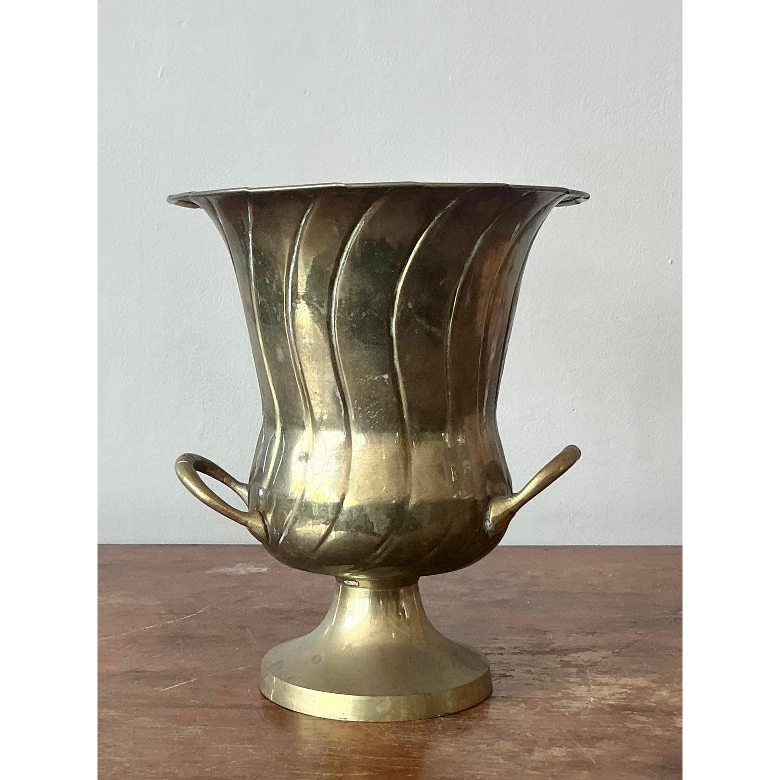 Presenting a superb Vintage Mid-Century Modern Fluted Brass Champagne Bucket, reminiscent of the distinguished designs often associated with Rosenthal. This elegant piece showcases a classic trophy-style silhouette with beautifully fluted details