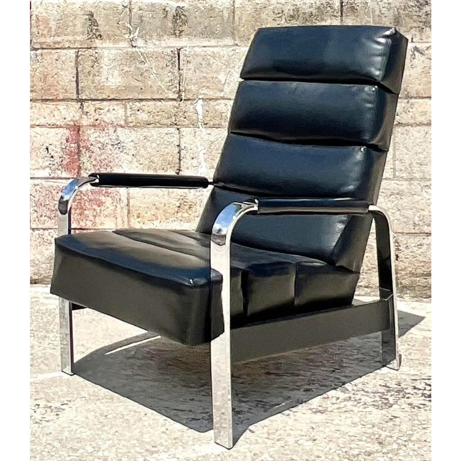 Fantastic vintage MCM reclining chair. Made by the iconic Milo Baughman for James Inc. beautiful black leather with flat bar chrome frame. Signed on the bottom. Acquired from a Palm Beach estate.