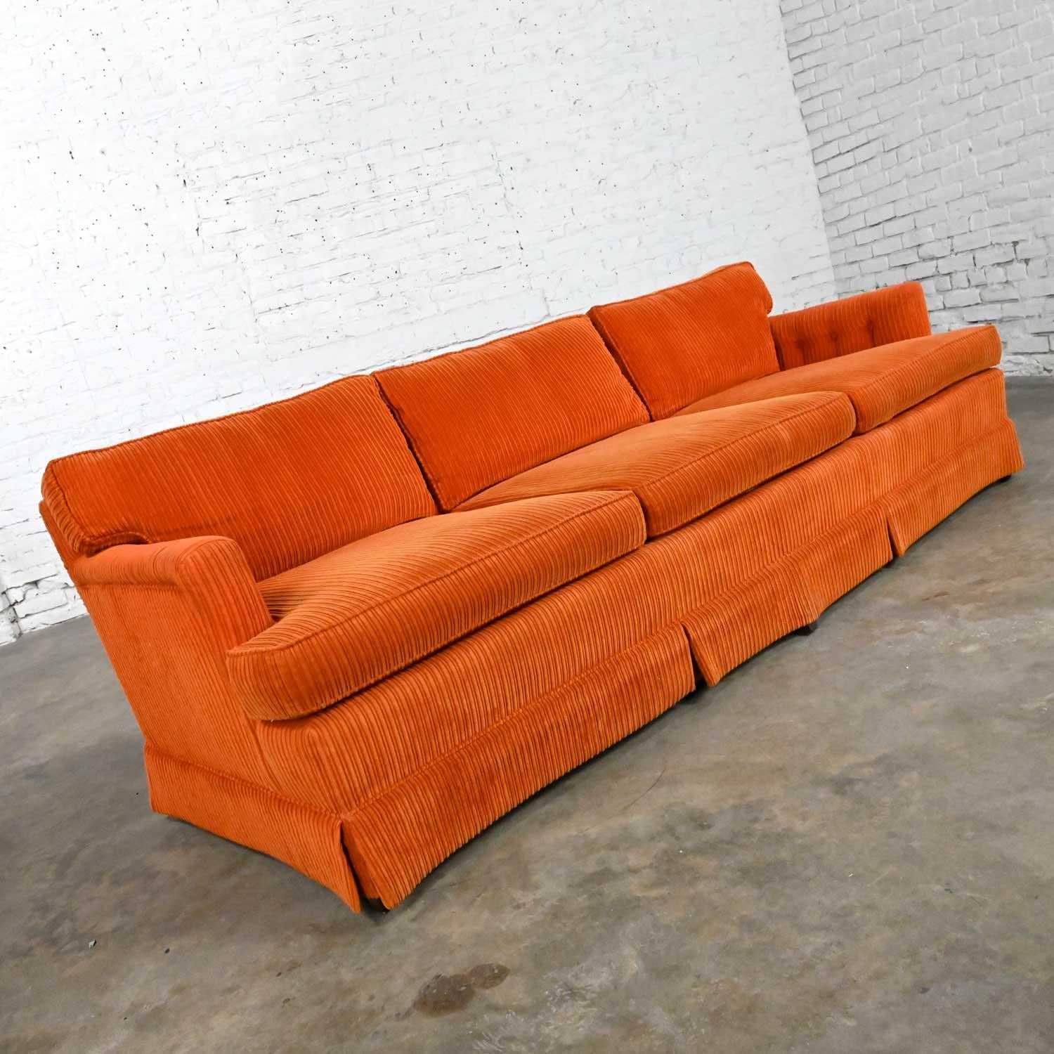 Awesome vintage MCM a.k.a. mid-century modern to modern Lawson style orange wide wale corduroy sofa by Drexel. Beautiful condition, keeping in mind that this is vintage and not new so will have signs of use and wear. We noticed some slight fading or