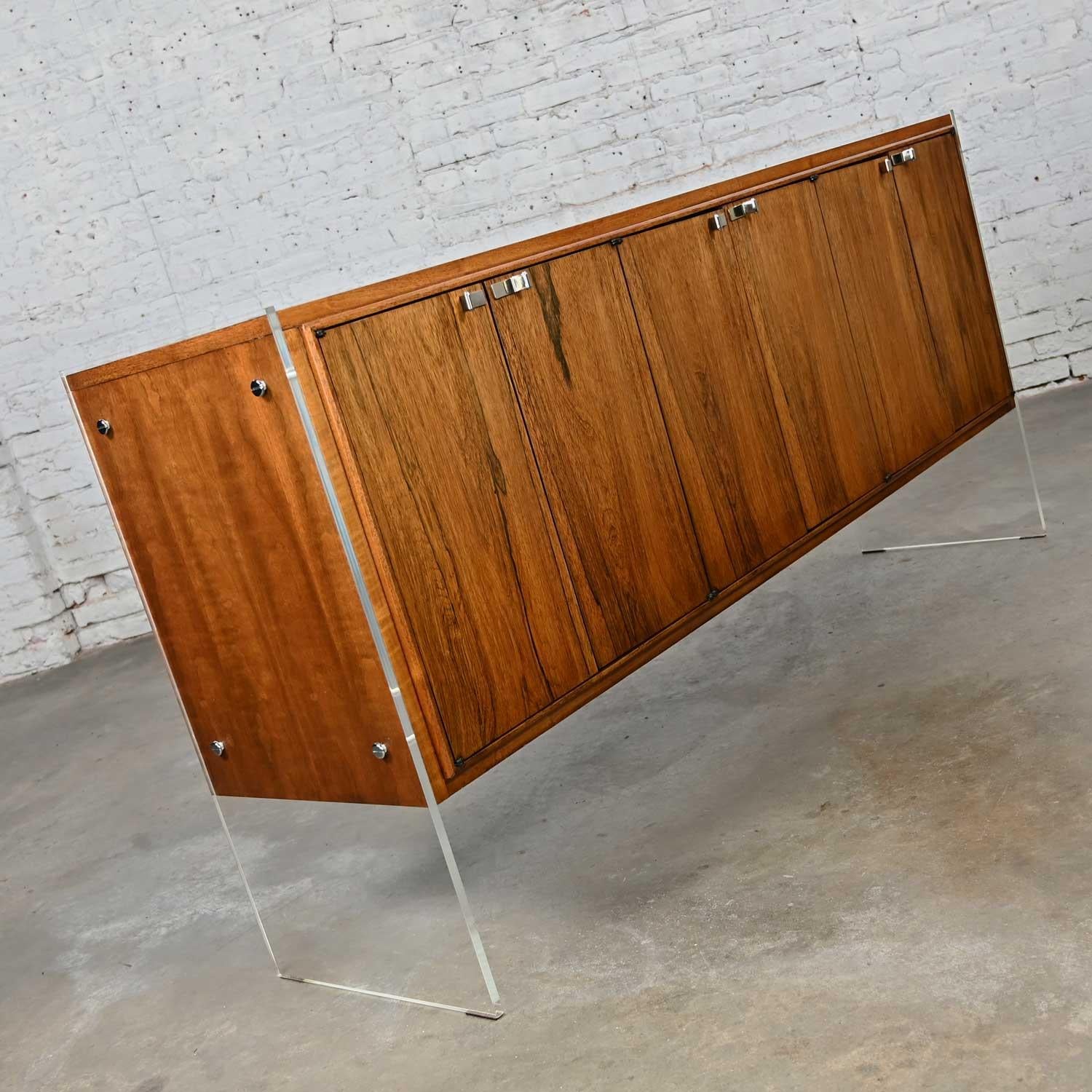 Fabulous vintage Mid-Century Modern to modern Rosewood buffet or credenza with Lucite legs & chrome accents attributed to Bernhardt Flair. This piece has been attributed based upon archived research including online sources, vintage documentation