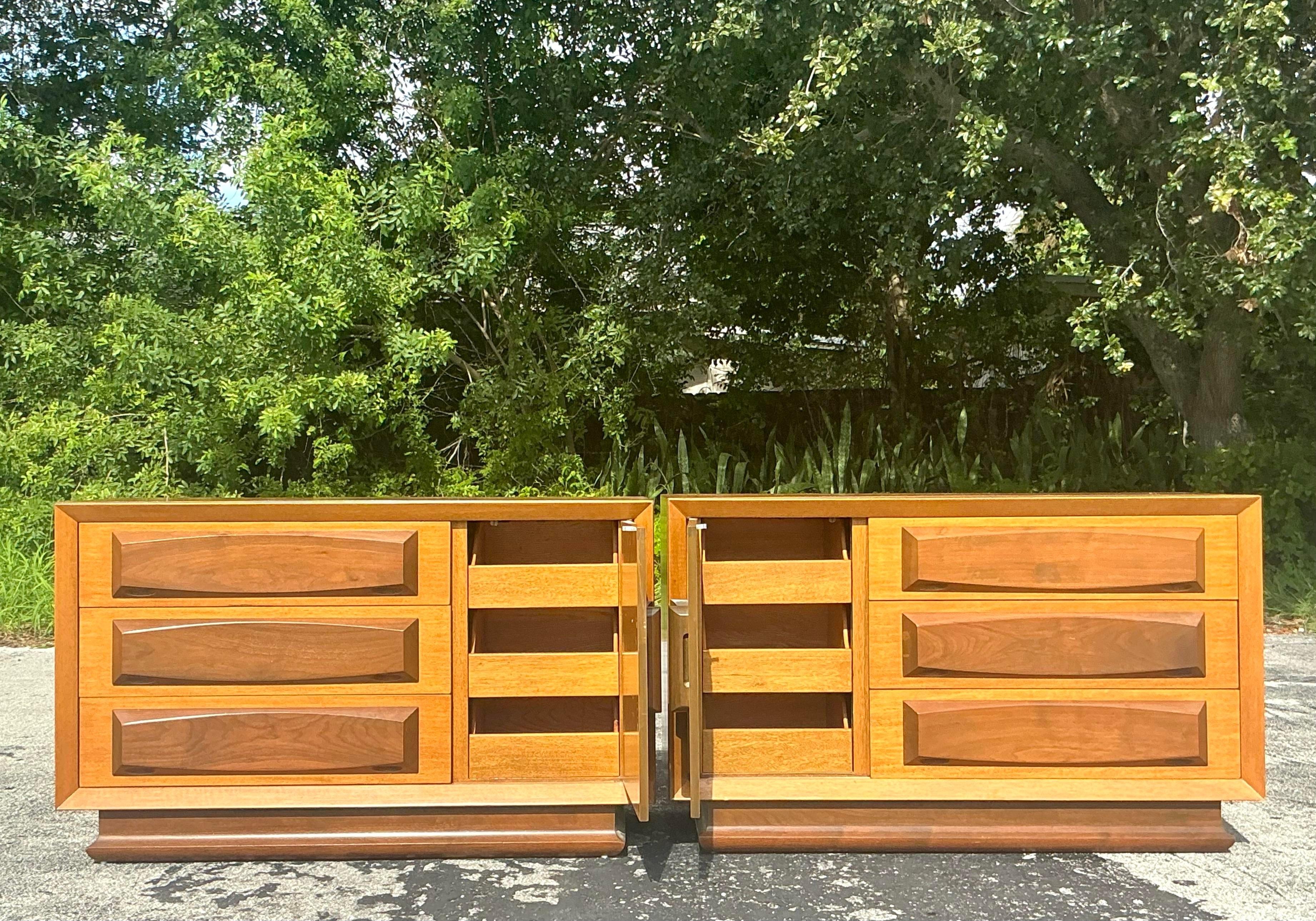 Enhance your bedroom with the refined elegance of these Vintage MCM VanLeigh Crest Dressers. Perfect for American-style interiors, this pair of mid-century modern dressers features clean lines, stylish hardware, and the quality craftsmanship