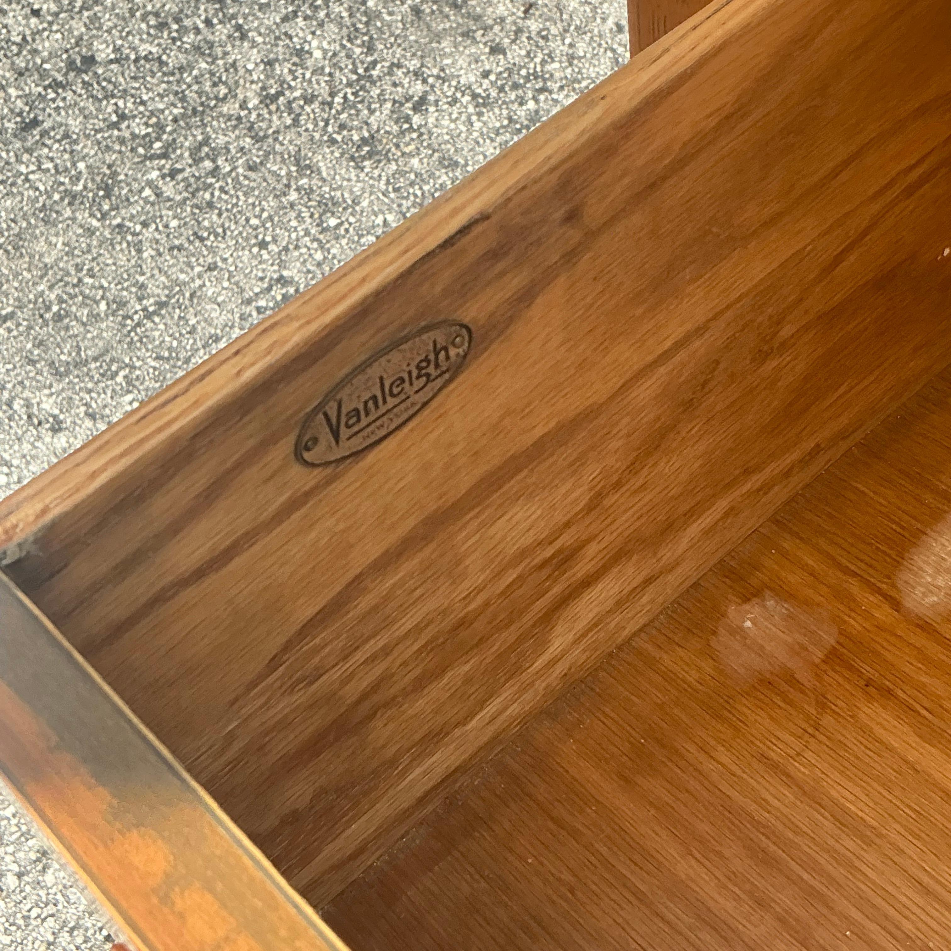 Enhance your bedroom with the sleek sophistication of these Vintage MCM VanLeigh Crest Nightstands. Perfect for American-style interiors, these mid-century modern nightstands feature clean lines, quality craftsmanship, and elegant detailing
