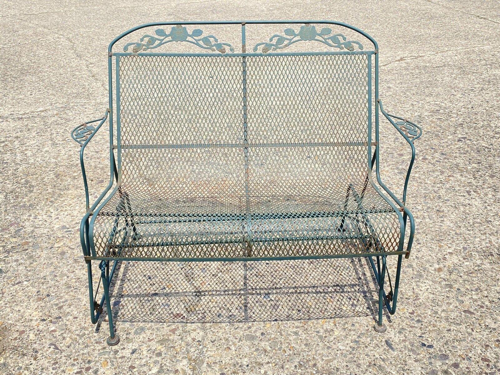 Vintage Meadowcraft Dogwood Green Wrought Iron Garden Patio Glider Loveseat. circa mid to late 20th century. Measurements: 35.5