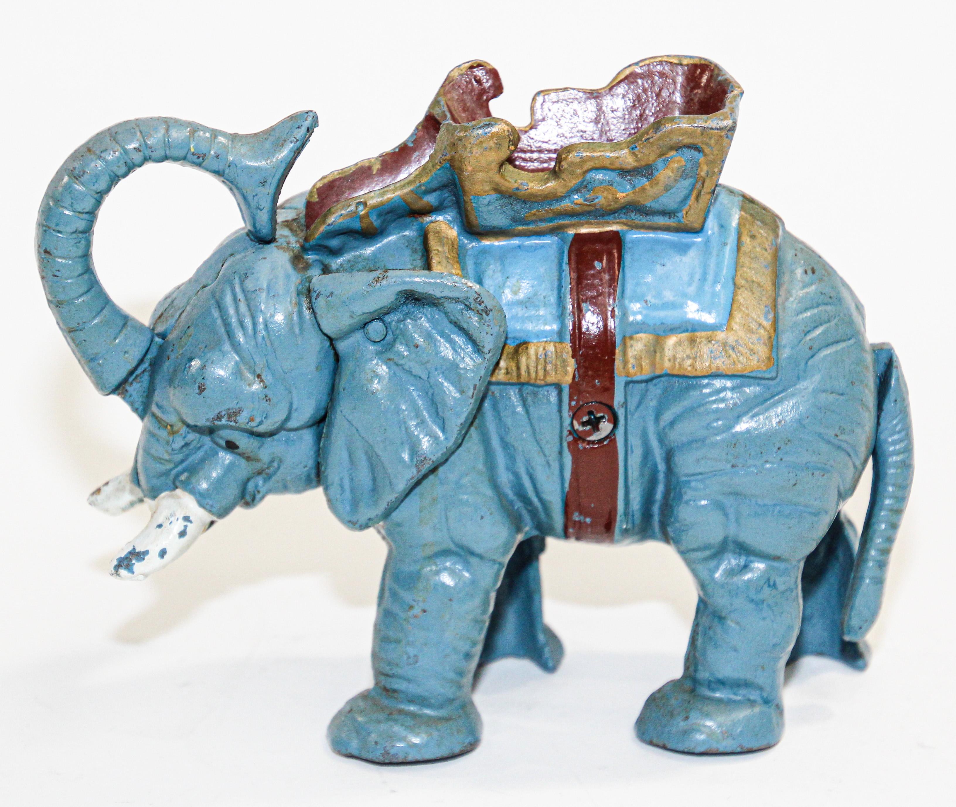 Vintage mechanical hand-painted cast iron elephant coin bank.
Mechanical bank in good working order with the original paint,
It operates as follows: Place a coin in his trunk and pull his trunk and he drops the coin in the bank.
hand painted cast
