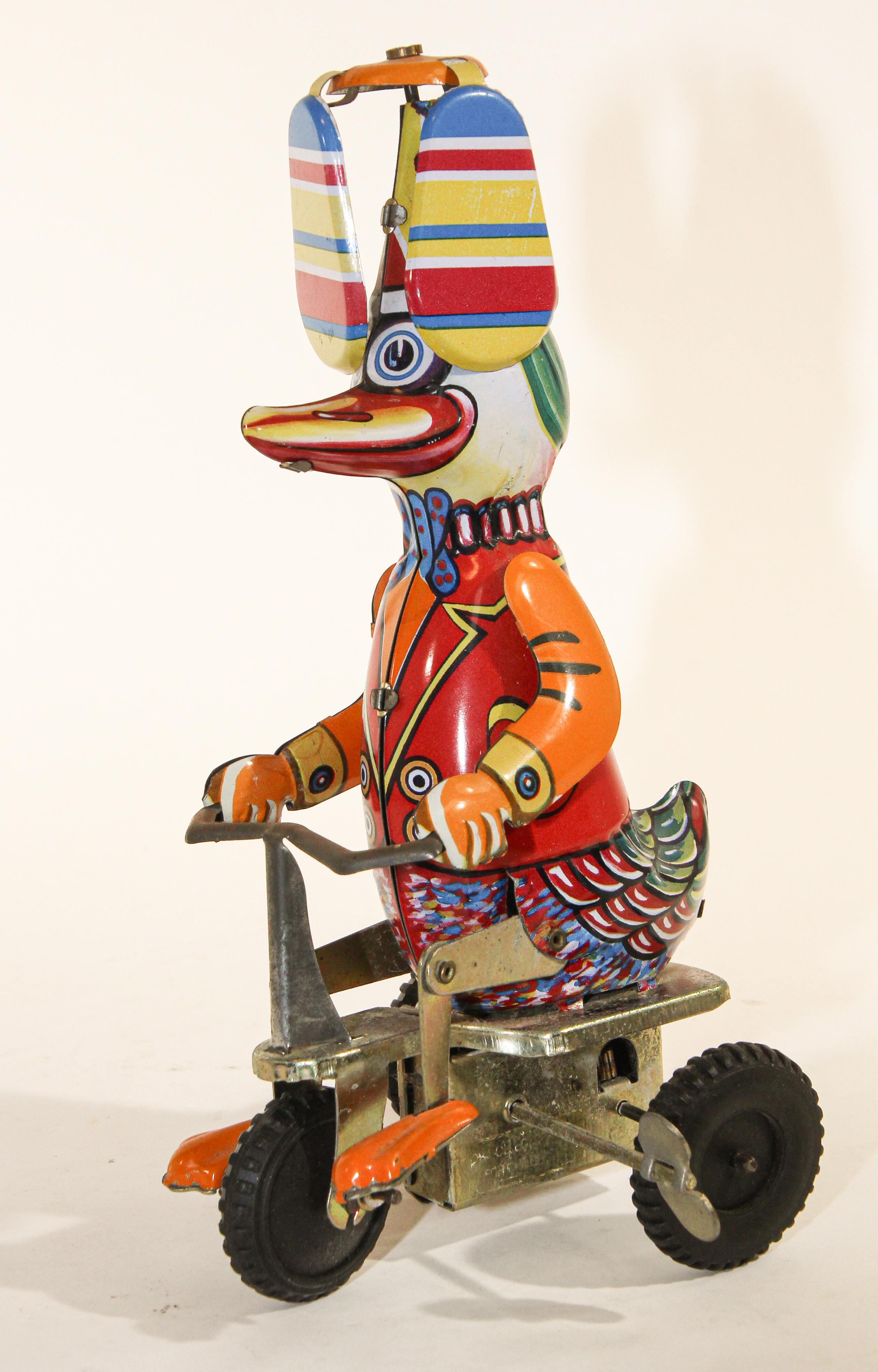 Vintage Mechanical Hand-Painted Wind-Up Duck on Bike 2