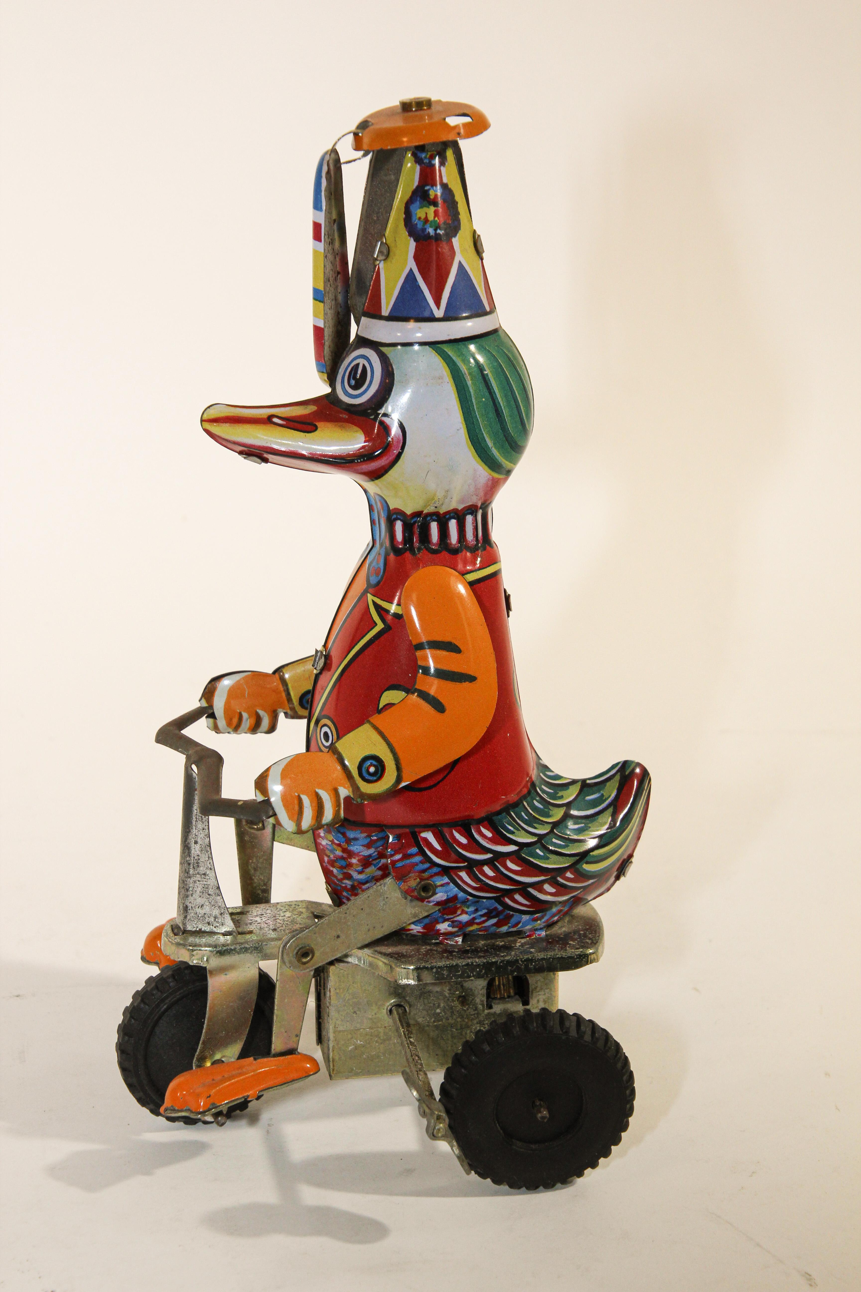 Vintage Mechanical Hand-Painted Wind-Up Duck on Bike 4