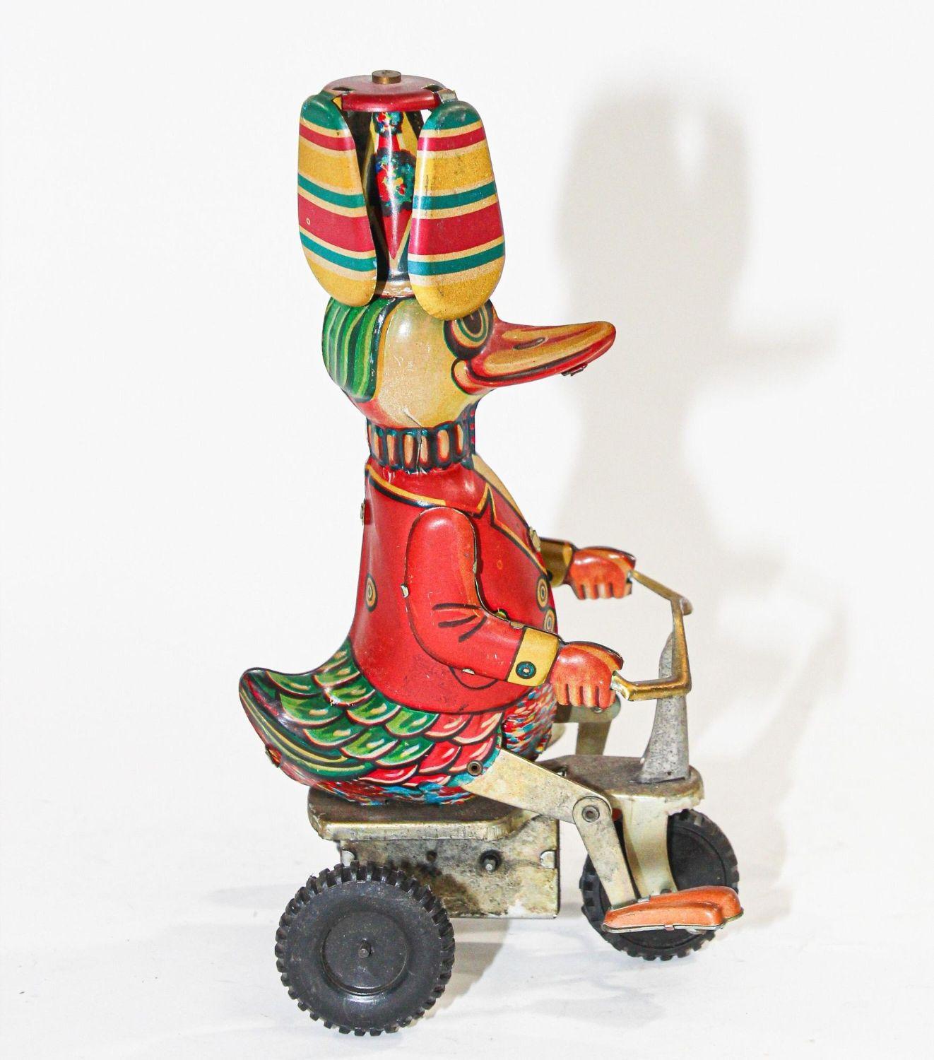 Hand-Crafted Vintage Mechanical Hand-Painted Wind-Up Duck on Bike