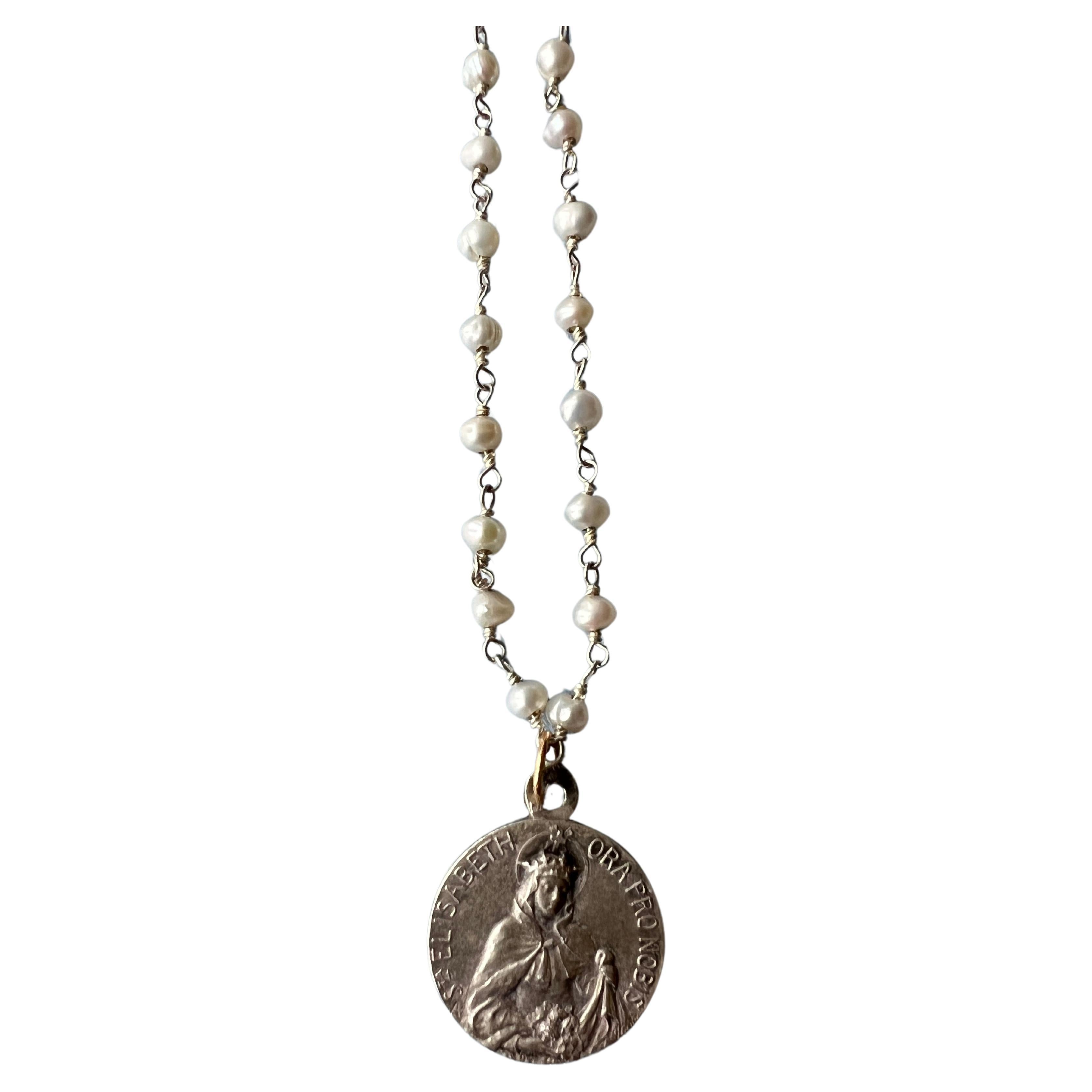 Vintage possibly Antique Medal featuring a female figure in a crown with a cross, holding flowers, and accompanied by the text 